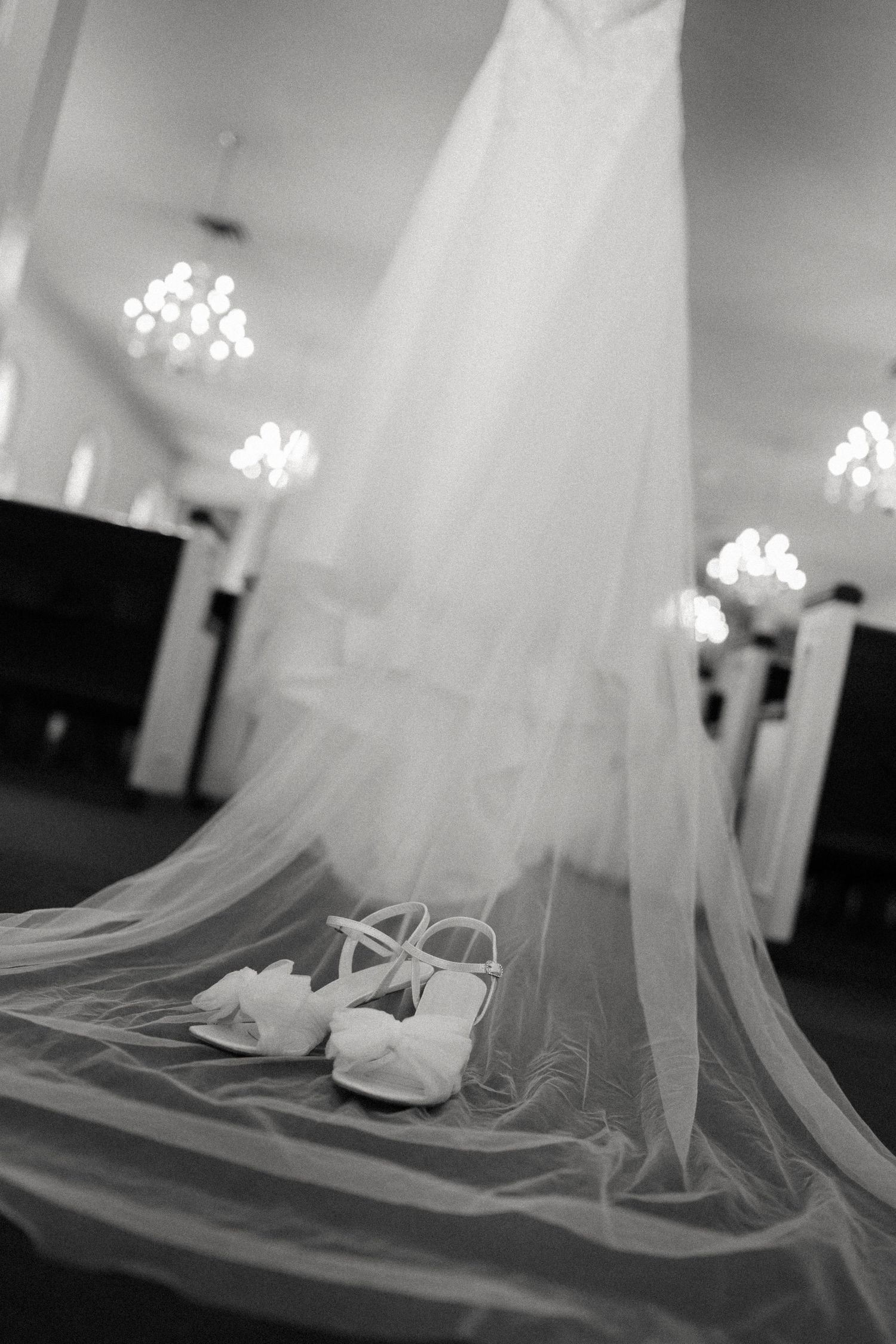 Artistic black and white photos of a wedding veil trailing across the floor.