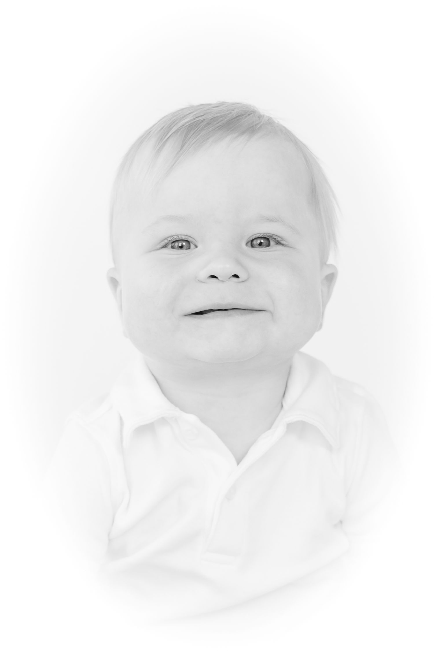 Close-up portraits of a baby's face showing different expressions against a white background.