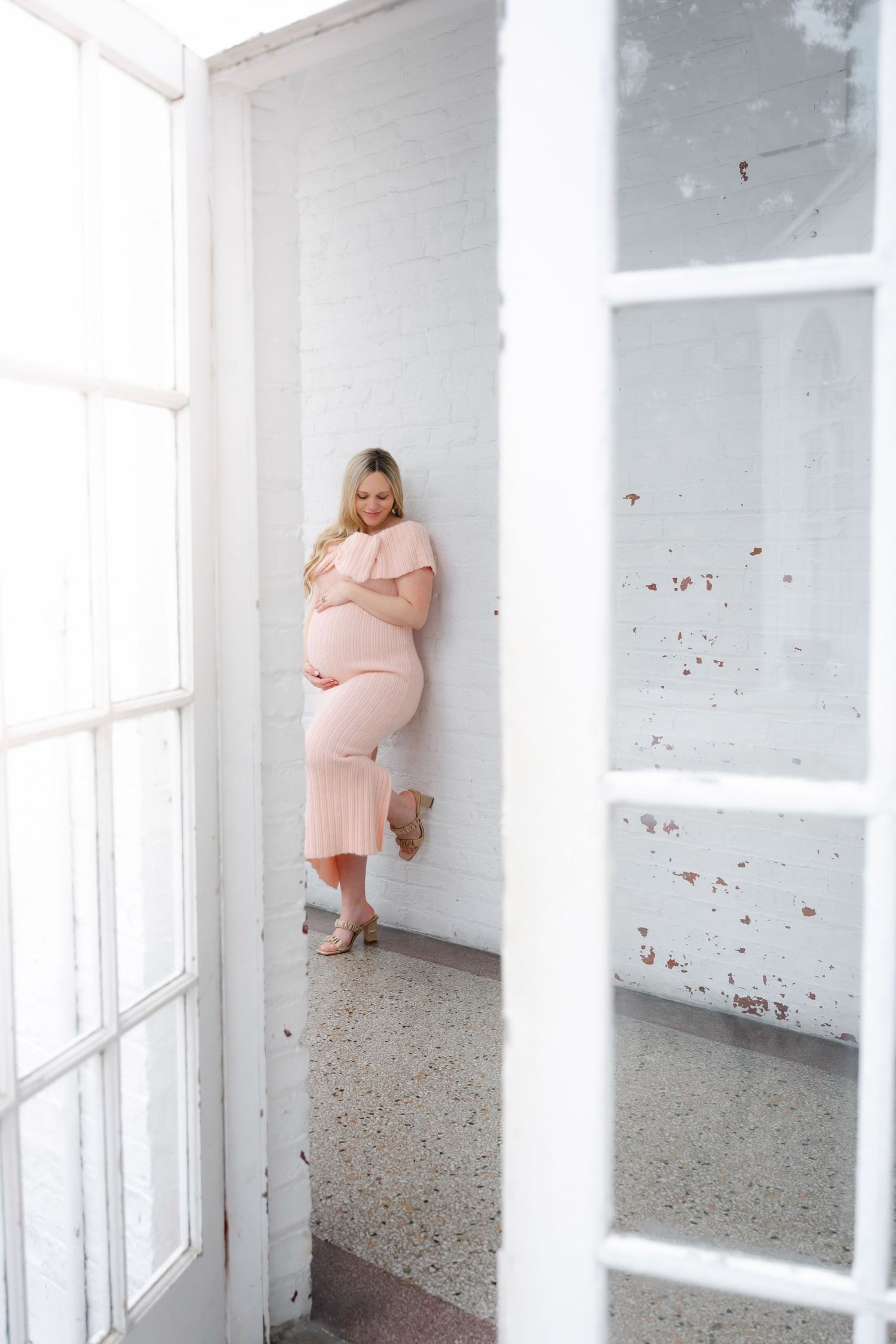 A series of artistic maternity photos in a bright white room with windows.