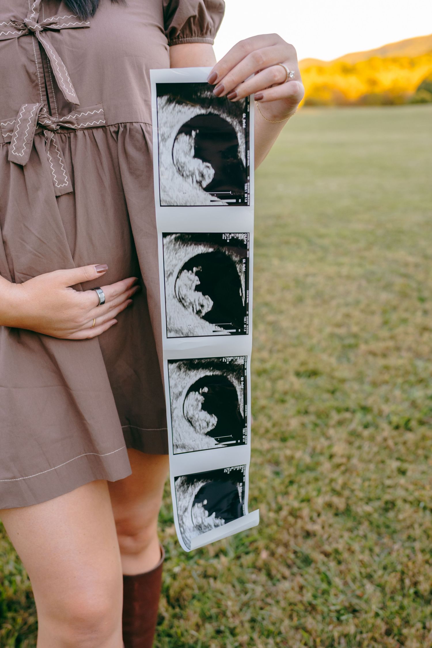 Close-up shots of people holding and looking at ultrasound photos in an outdoor setting.