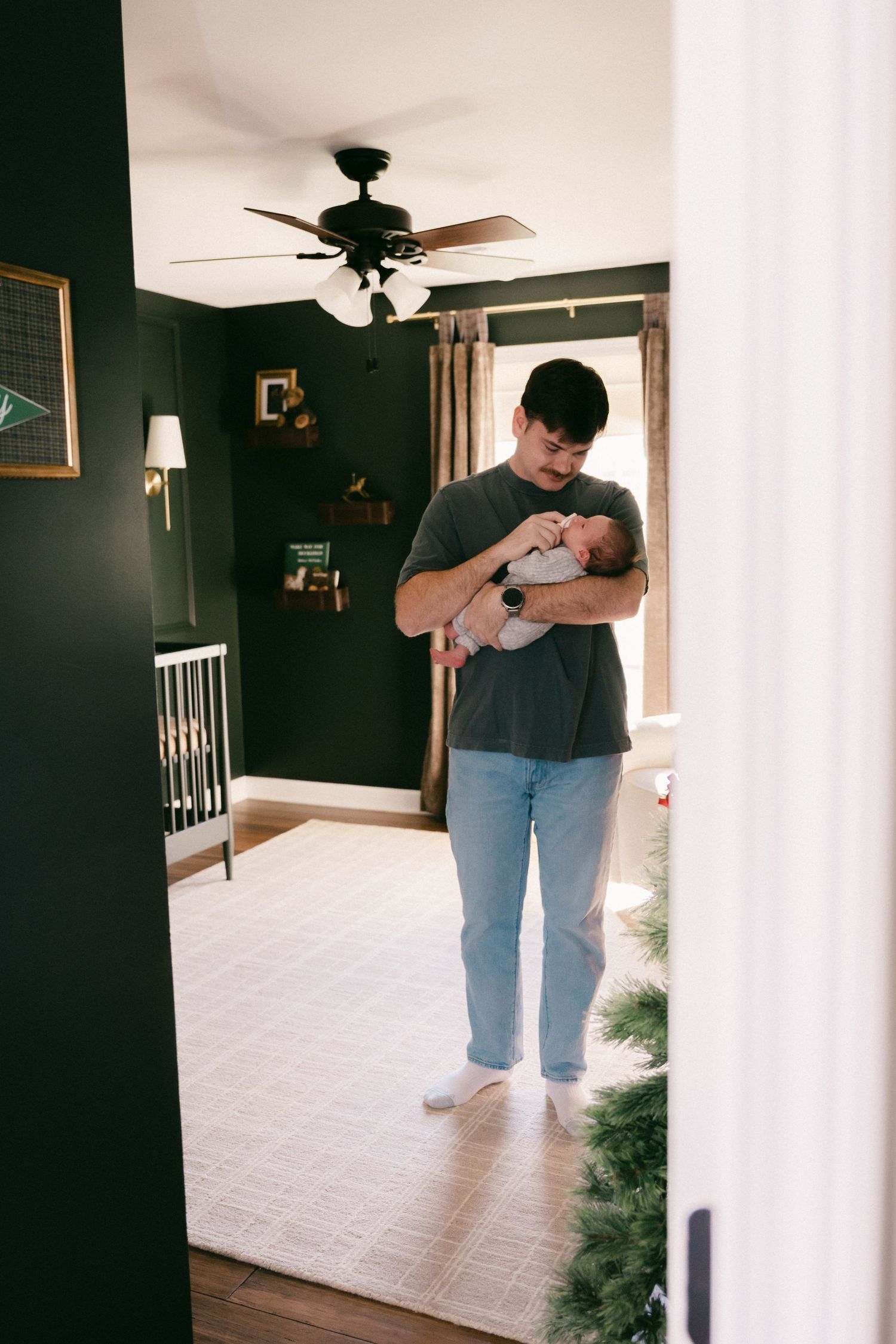 Candid shots of people holding and caring for a baby in a nursery setting.