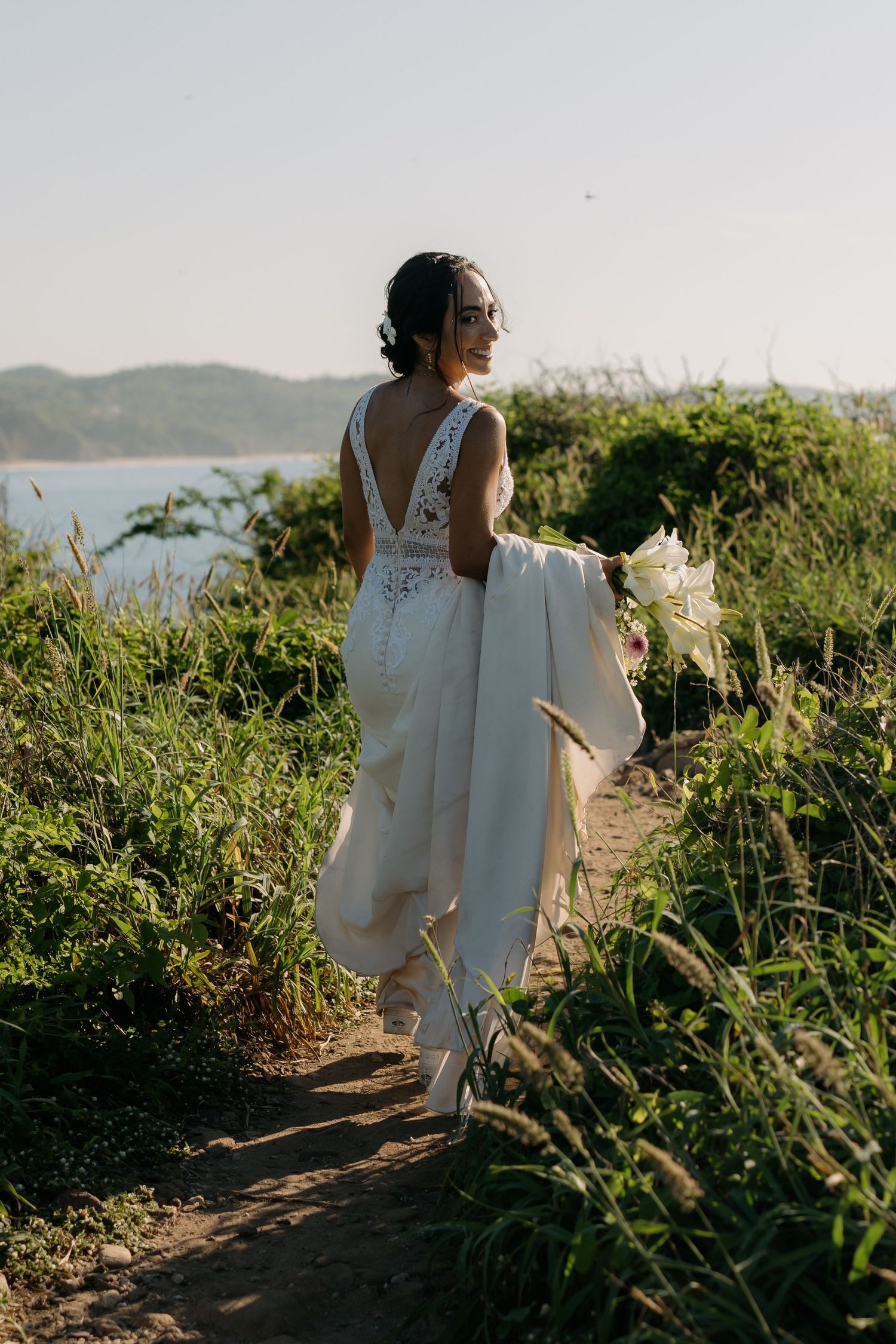 Bride looking back in Punta Cometa, Oaxaca elopement.