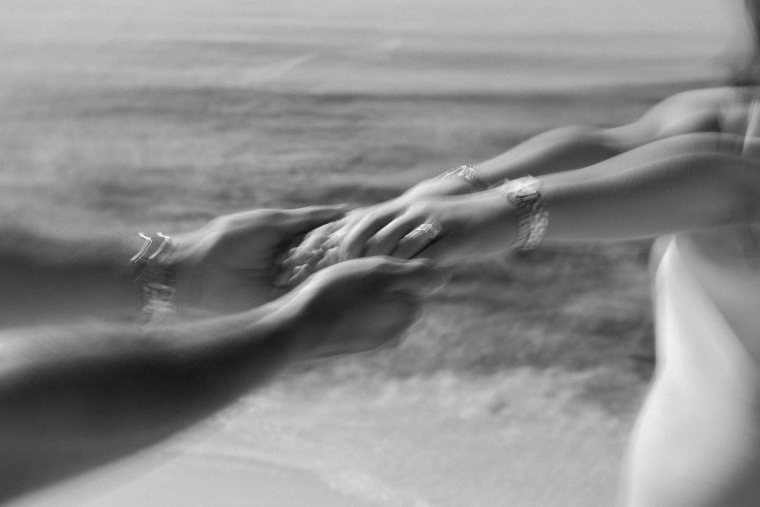 Couple holding hands in a playful moment in Playa del Carmen Mexico