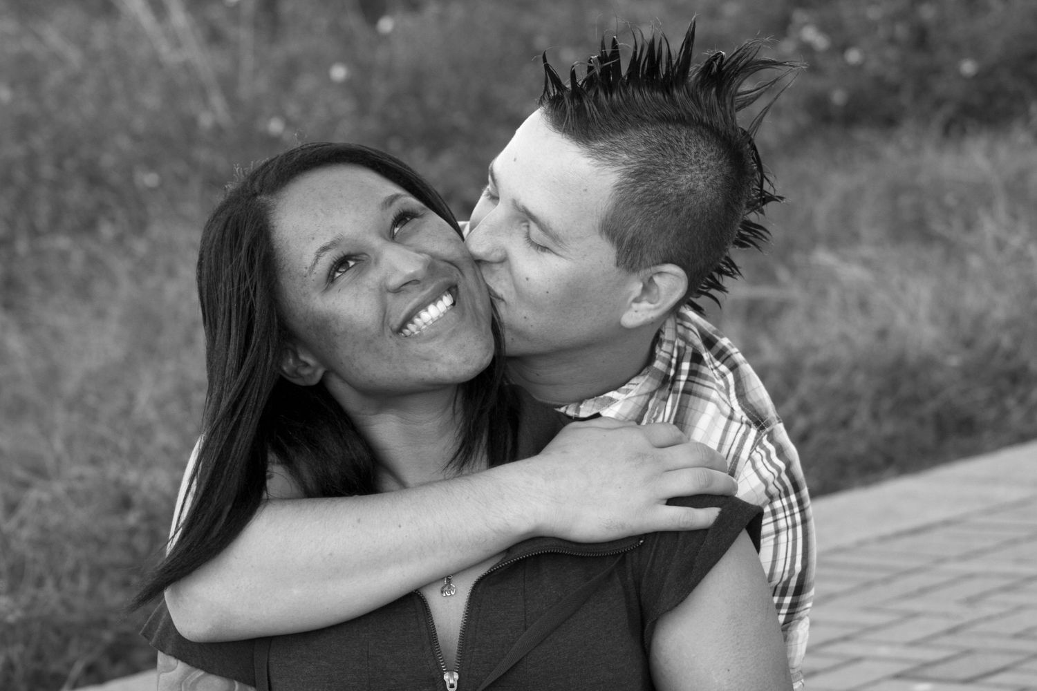 Black and white collage of intimate couple portraits showing affectionate moments outdoors at sunset.