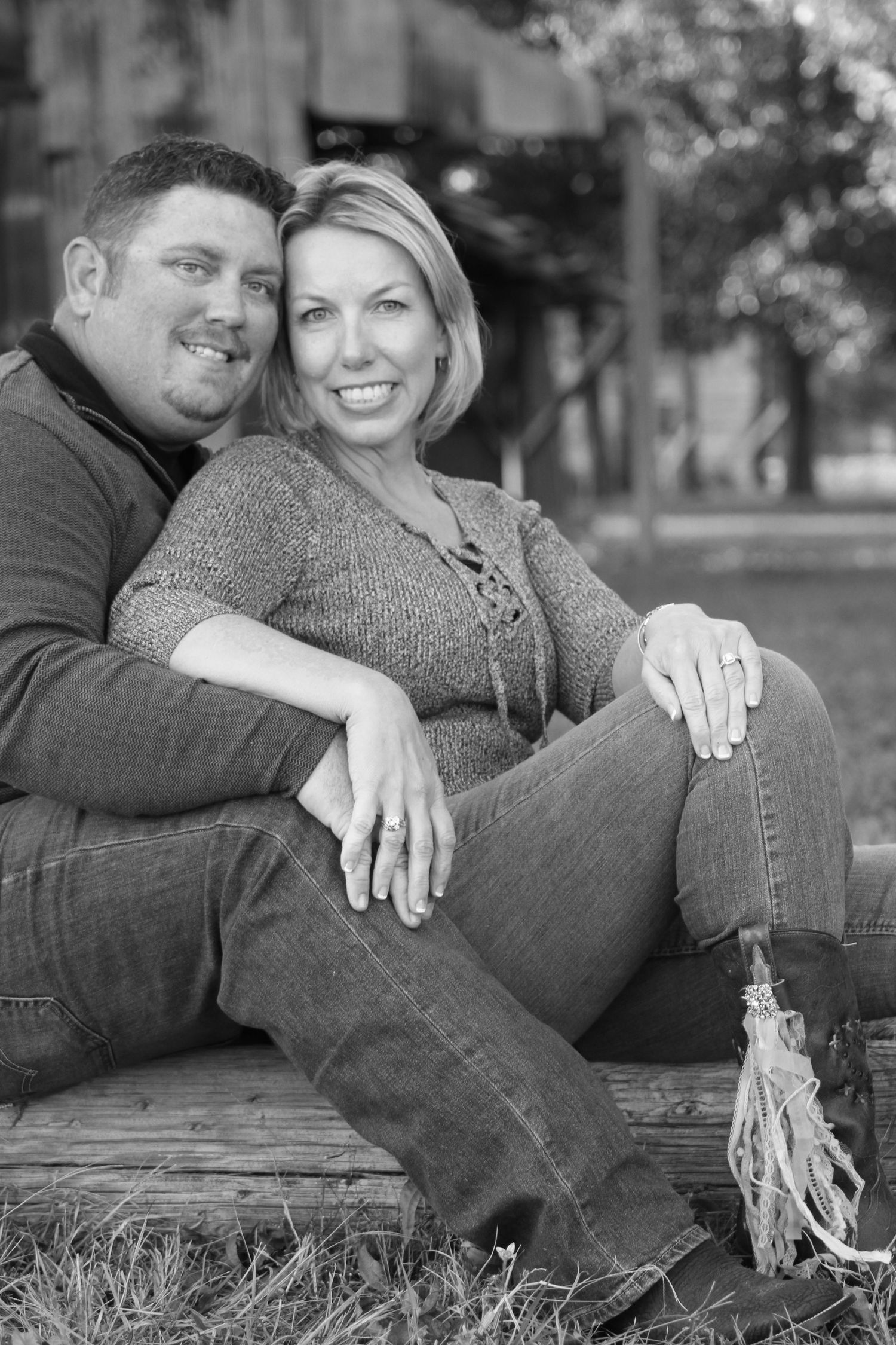 Casual engagement photos of couple relaxing together on grass in black and white. Milton real estate. Engagement Shoot. Countryside.