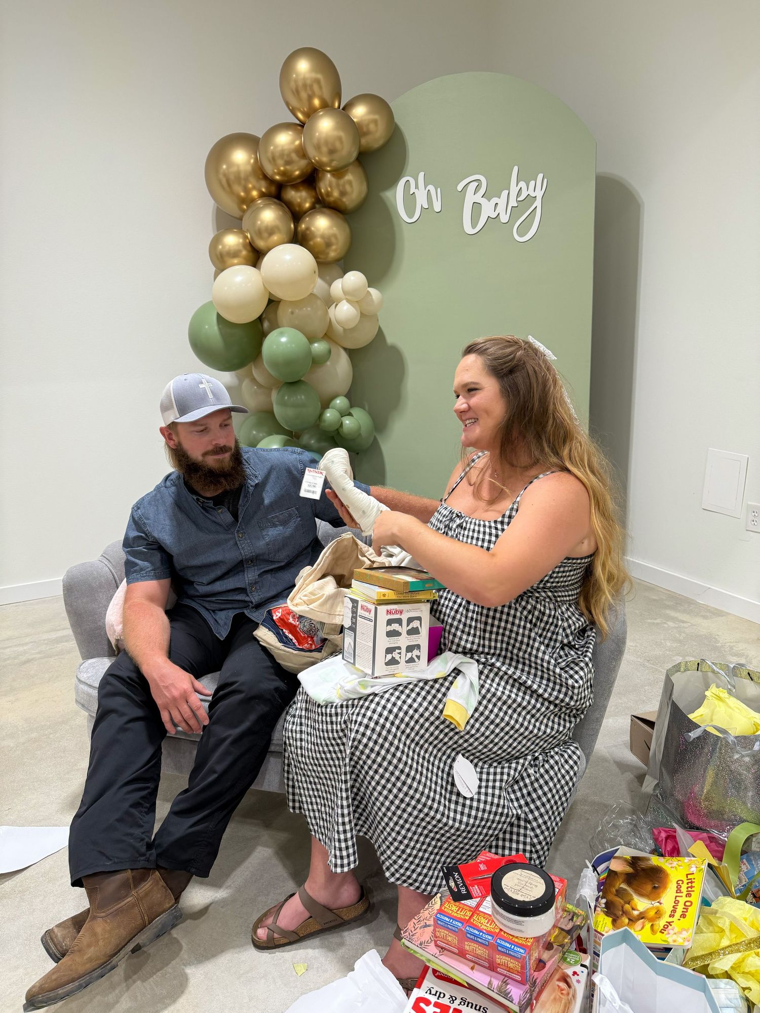 Interior space shows a check pattern dress and casual setting with gold balloon decorations on mint green walls.