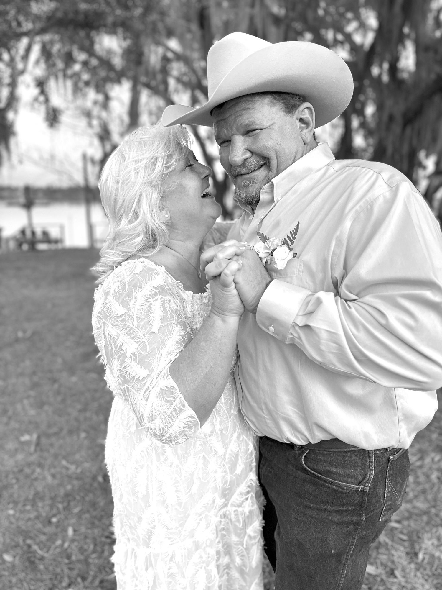 A romantic black and white photo sequence showing an affectionate couple embracing and wearing western-style clothing.
