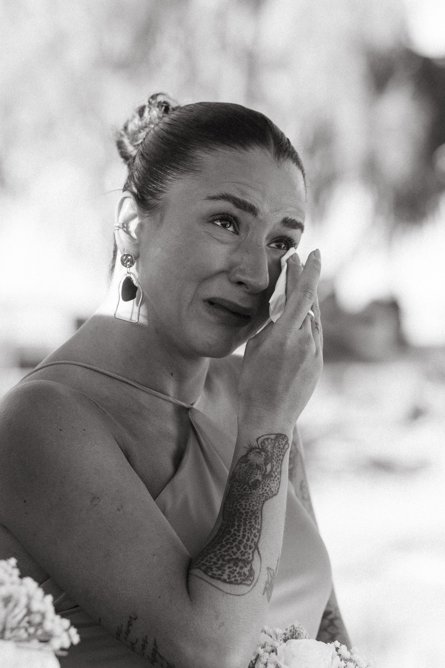A series of black and white artistic portraits showing emotional expressions and poses in a dreamy soft focus style.