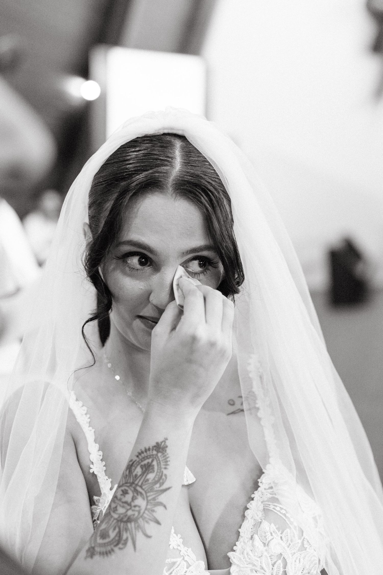 A sequence of close-up shots showing a bride in a white veil with delicate lace details.