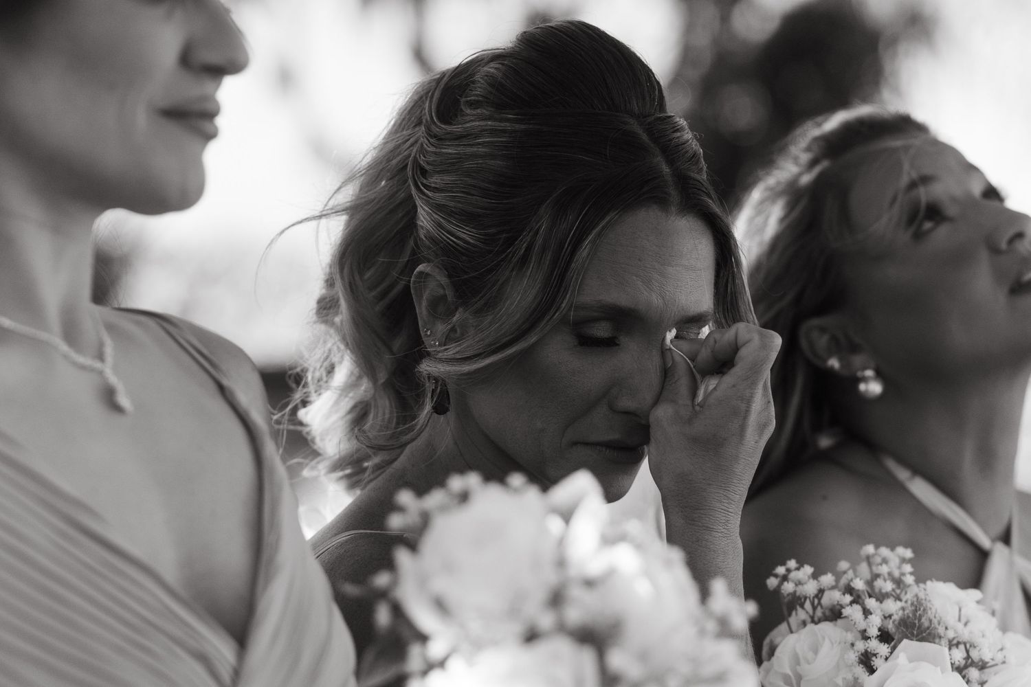 A series of black and white candid moments showing pure joy at a wedding celebration.