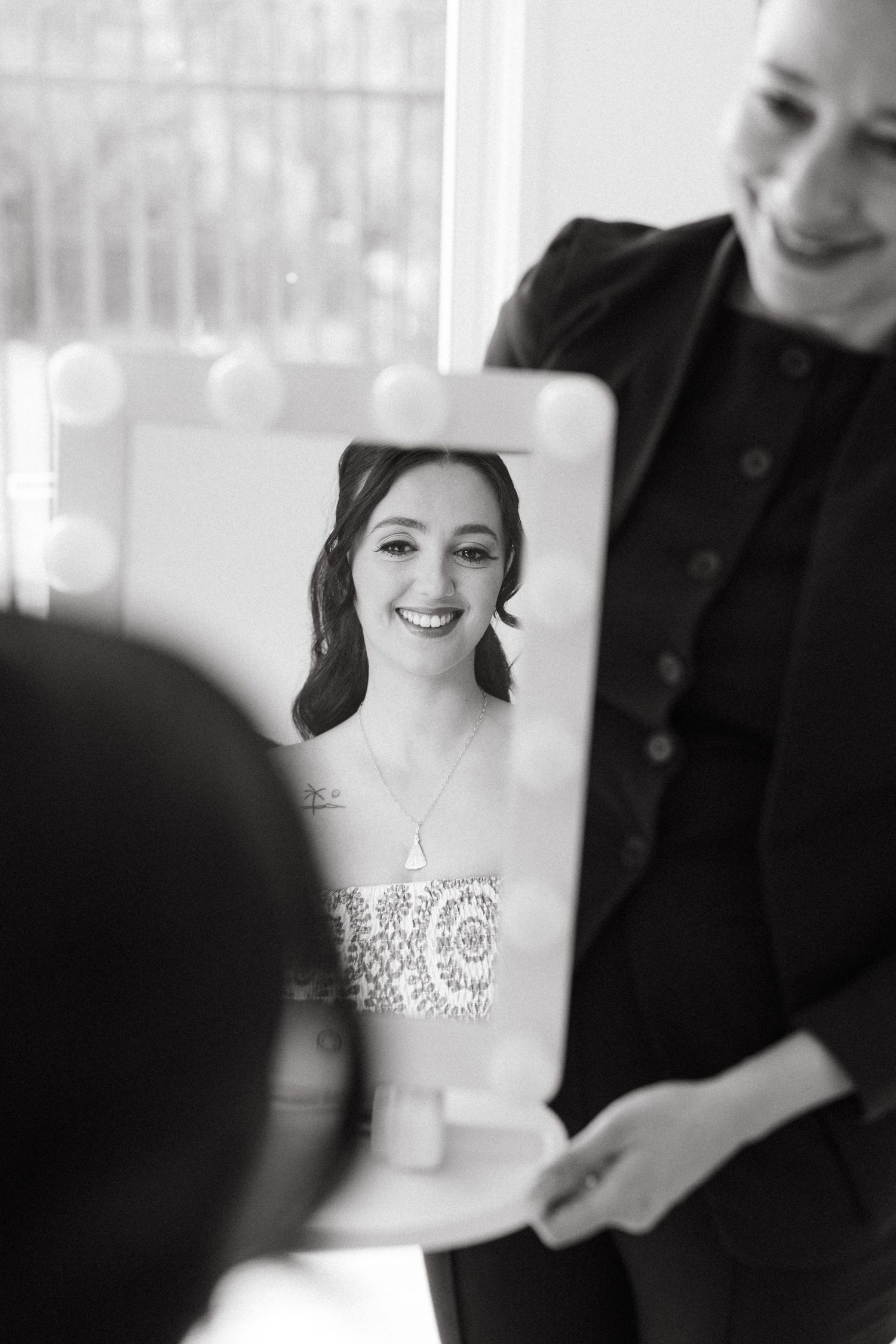 Black and white portrait series capturing candid moments of joy and laughter.