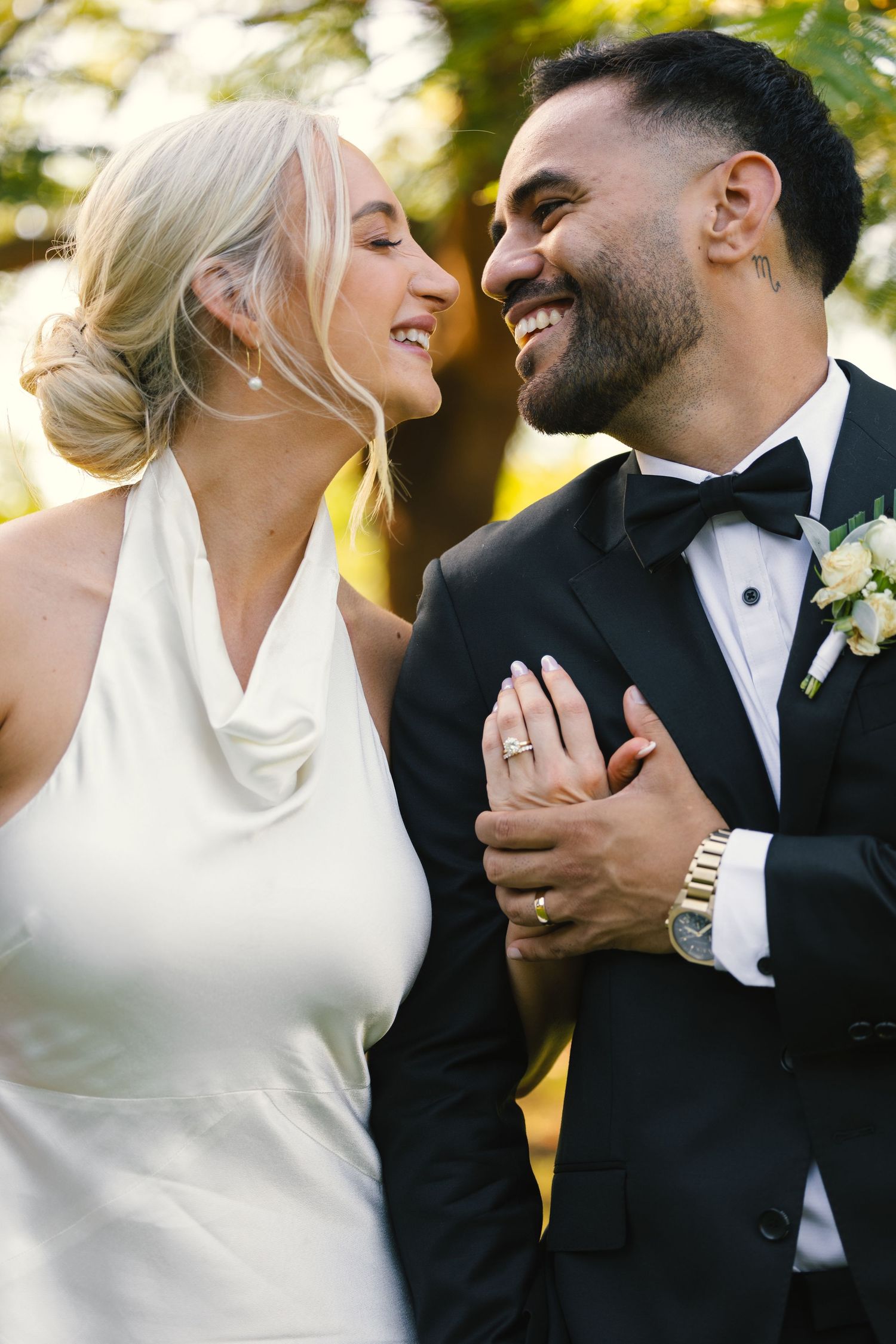 A romantic wedding couple shares intimate moments in a series of candid outdoor photos in warm sunlight.