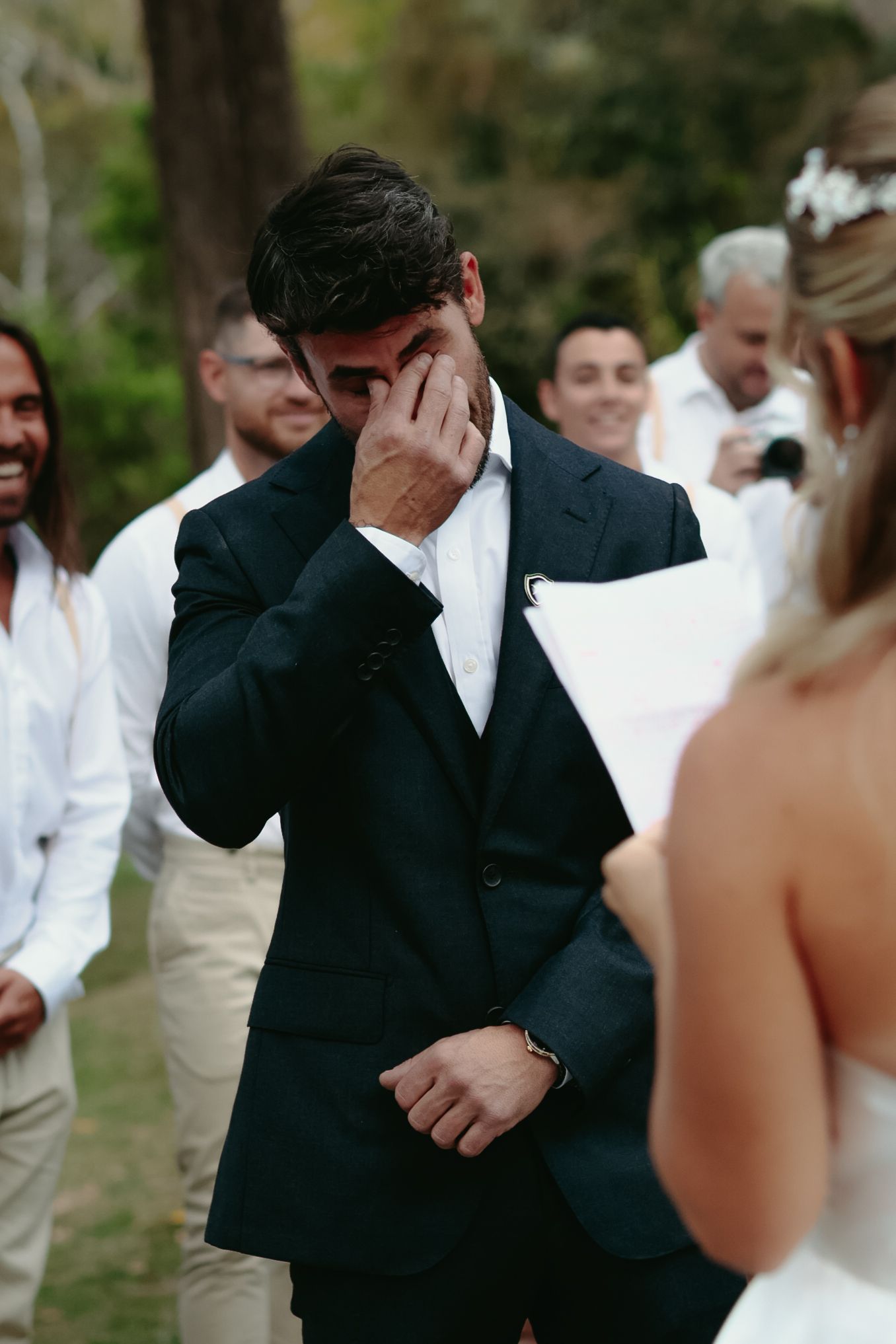 Emotional wedding ceremony moments captured in a series of candid photographs.