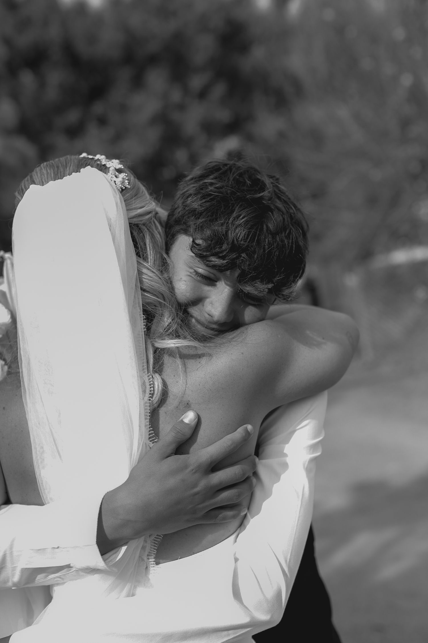 A sequence of intimate black and white wedding moments between the newlyweds.