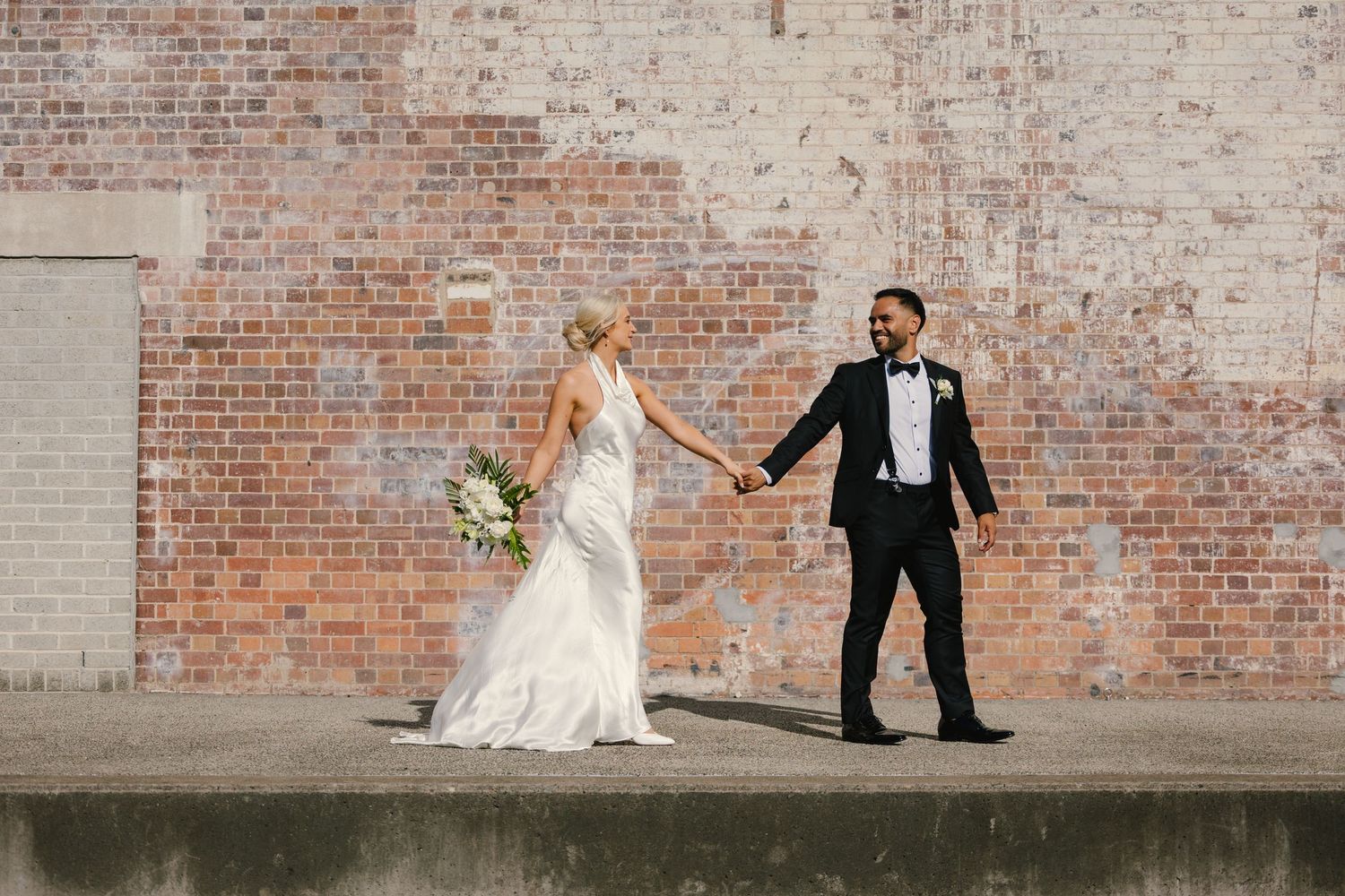 A bride and groom share romantic moments against a rustic brick wall backdrop in a wedding photo collage.
