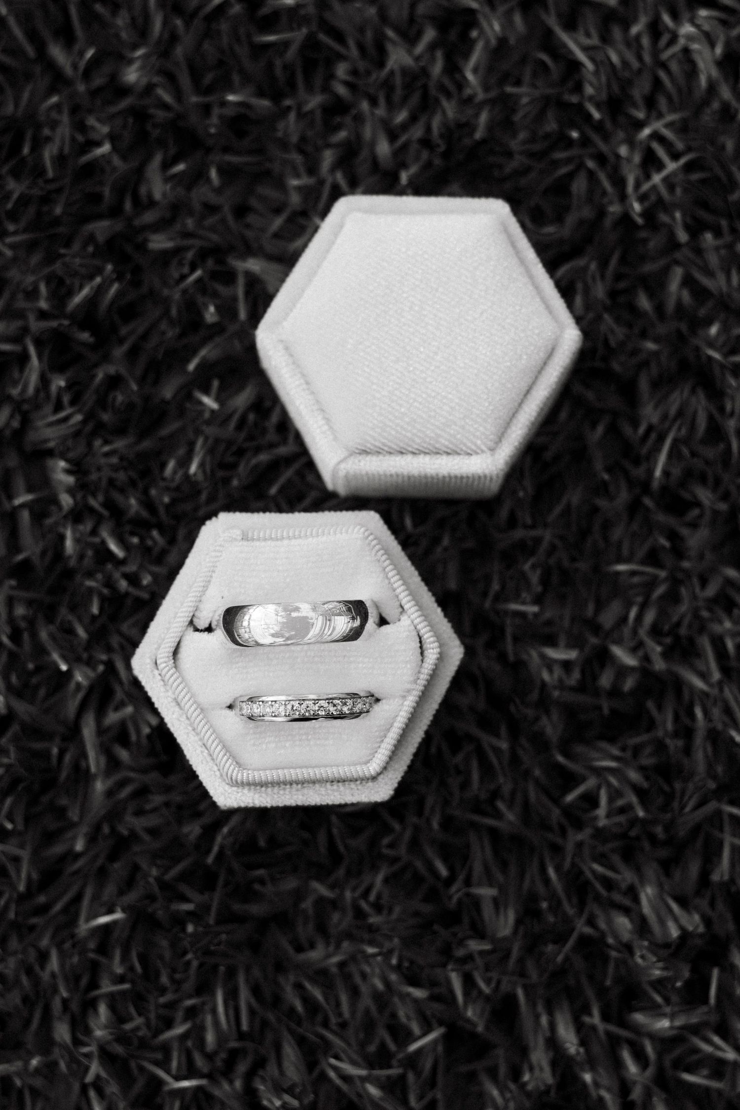 A sequence of photos showing a white hexagonal ring box opening to reveal a diamond engagement ring on a dark background.