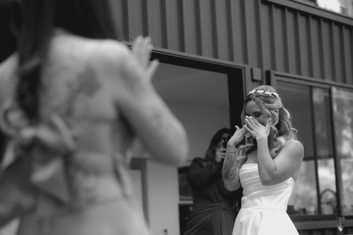 Wedding couple shares tender moments outside a building in a series of candid shots.