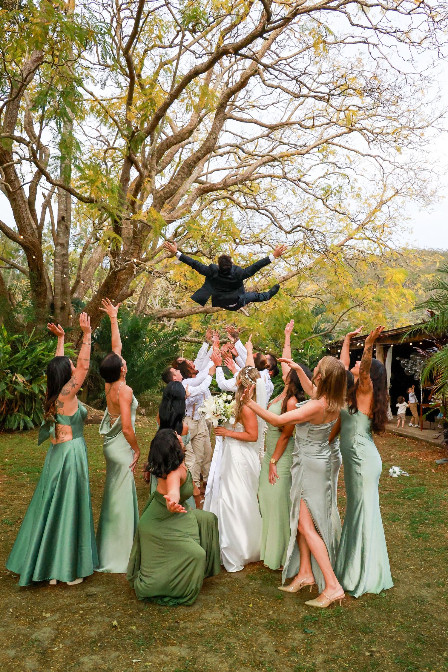 Wedding party in mint green dresses poses playfully in a sequence of outdoor photos under autumn trees.