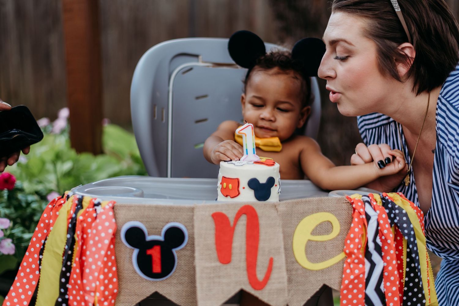 Colorful Mickey Mouse themed party decorations with polka dot patterns.