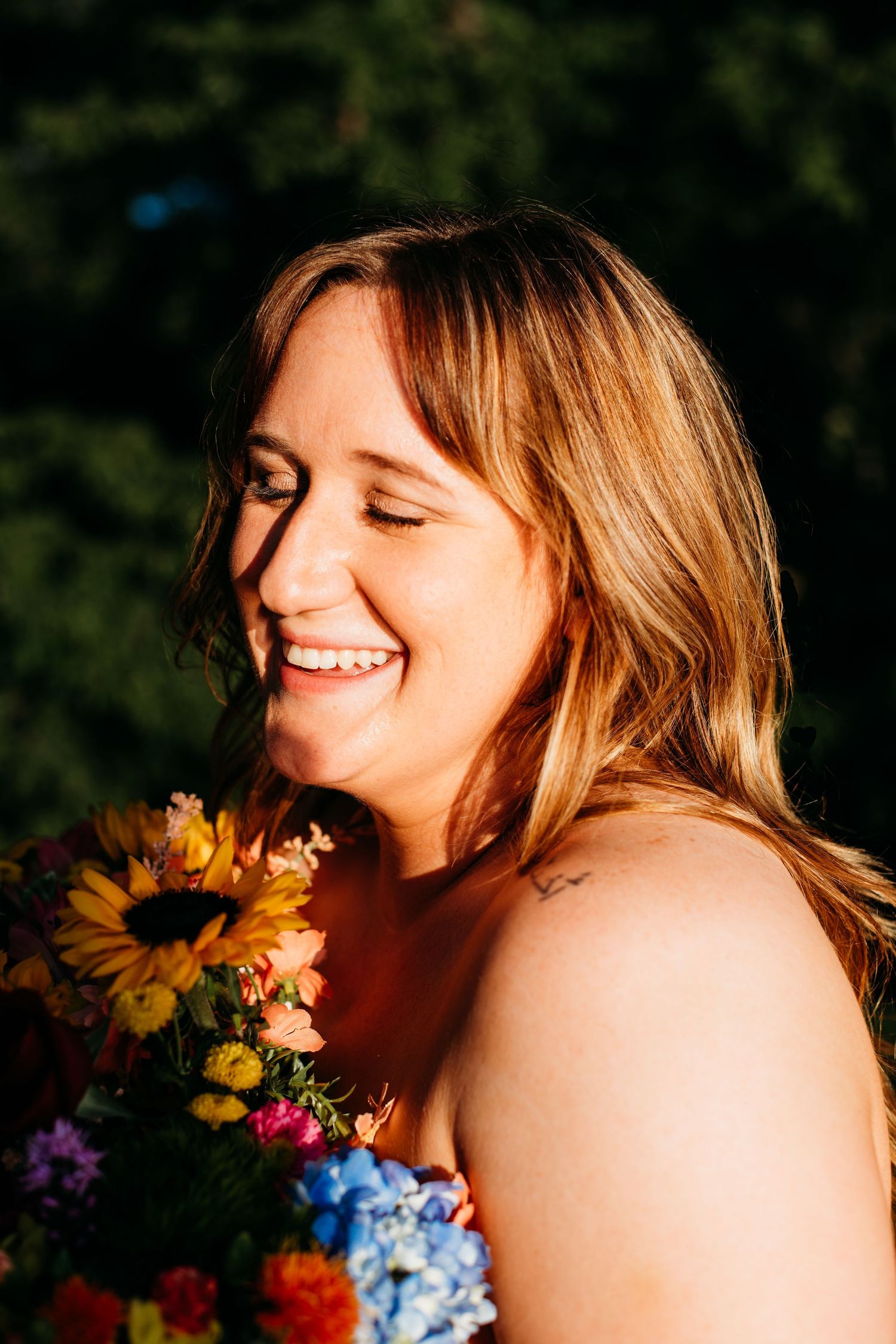 Artistic portrait series with flowers and golden hour sunlight.