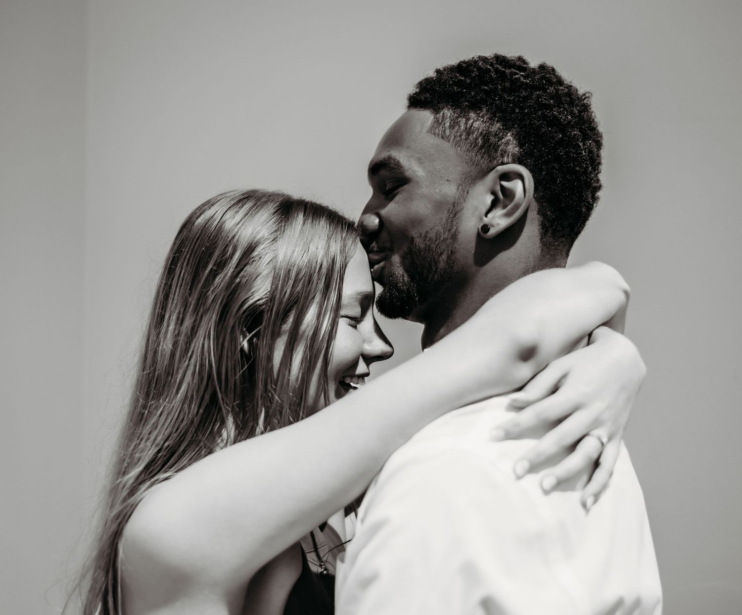 A romantic black and white photo series showing intimate moments between a couple.