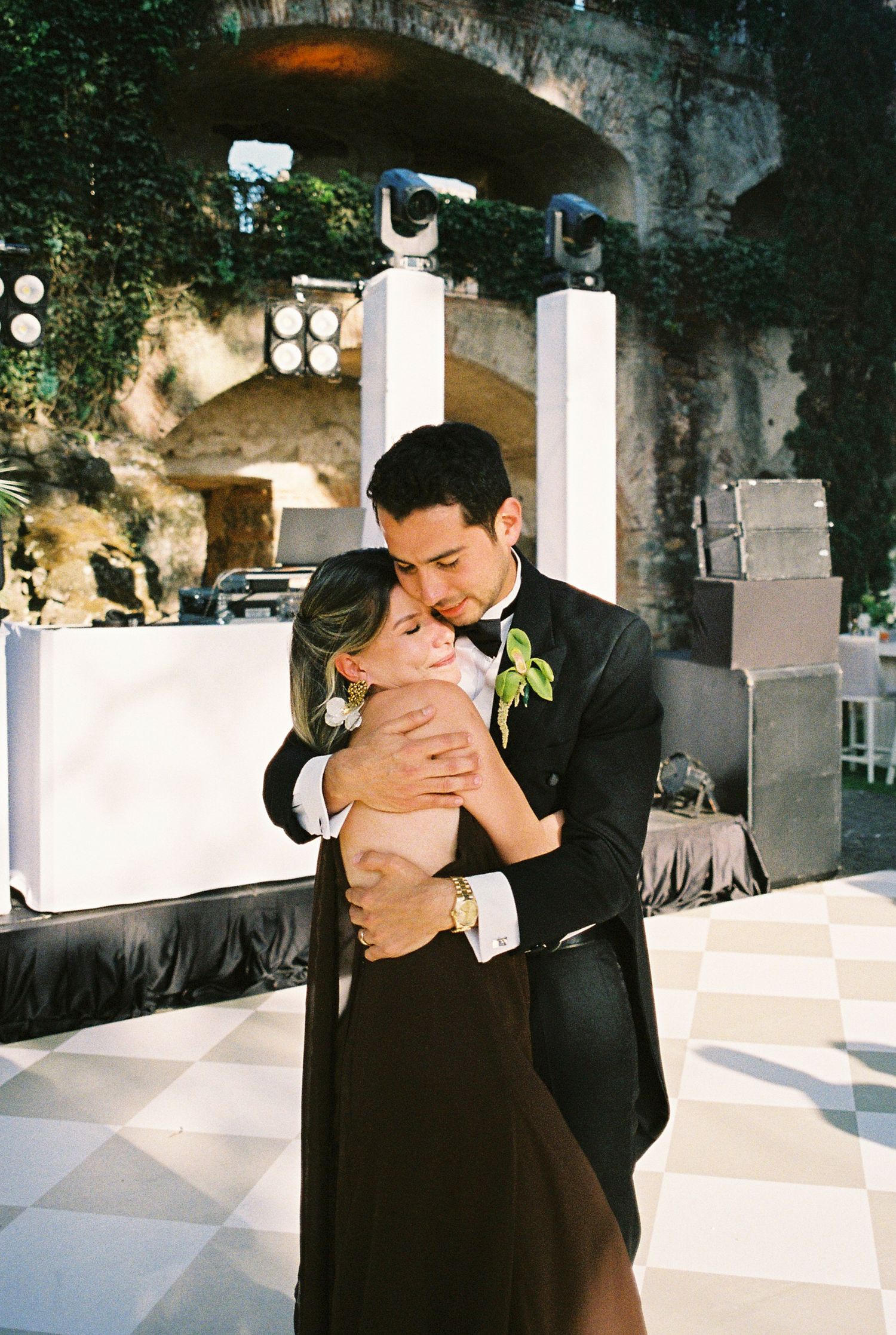 Intimate wedding moments captured against rustic stone architecture.