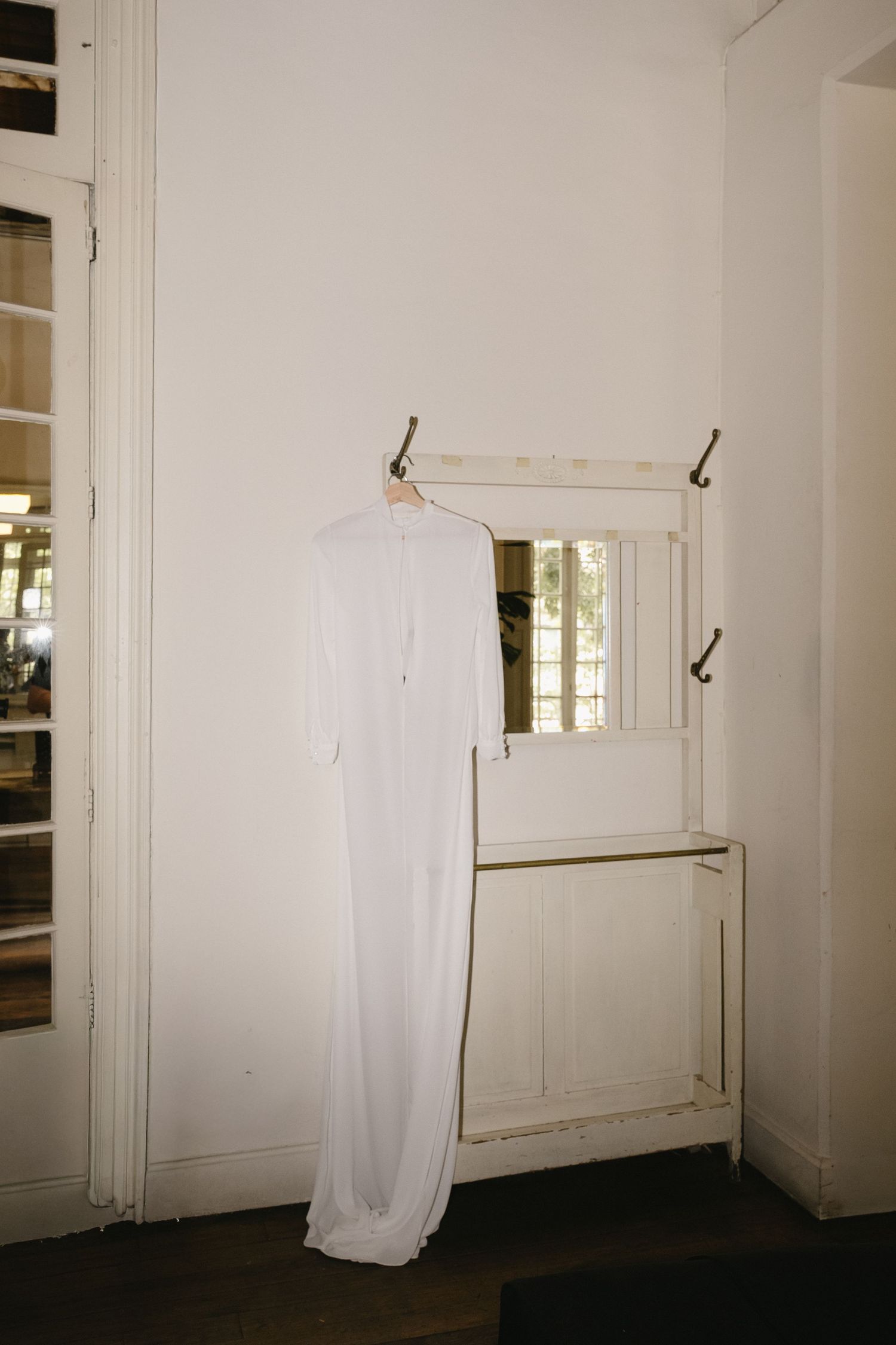 White fabric installations hanging in an empty minimalist room.