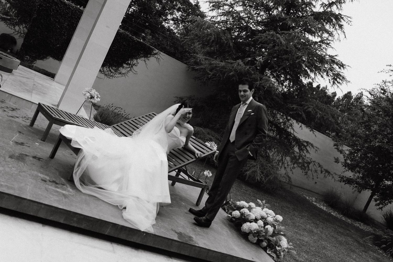 Romantic outdoor wedding photography session in a garden setting.