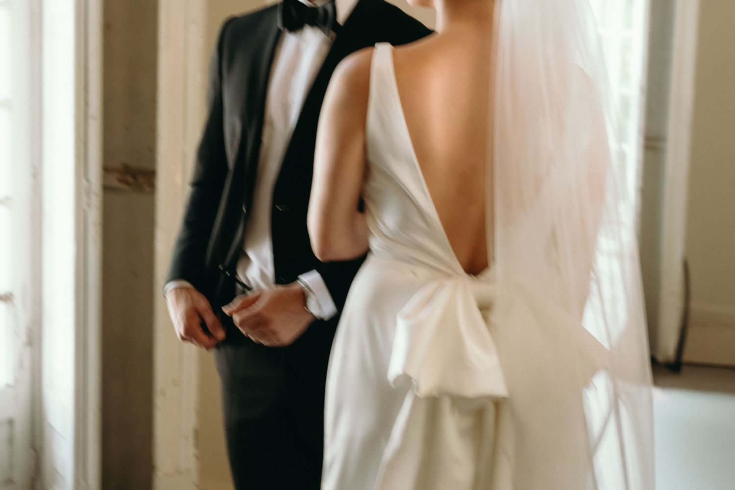 Romantic wedding photography captured in a bright interior setting.