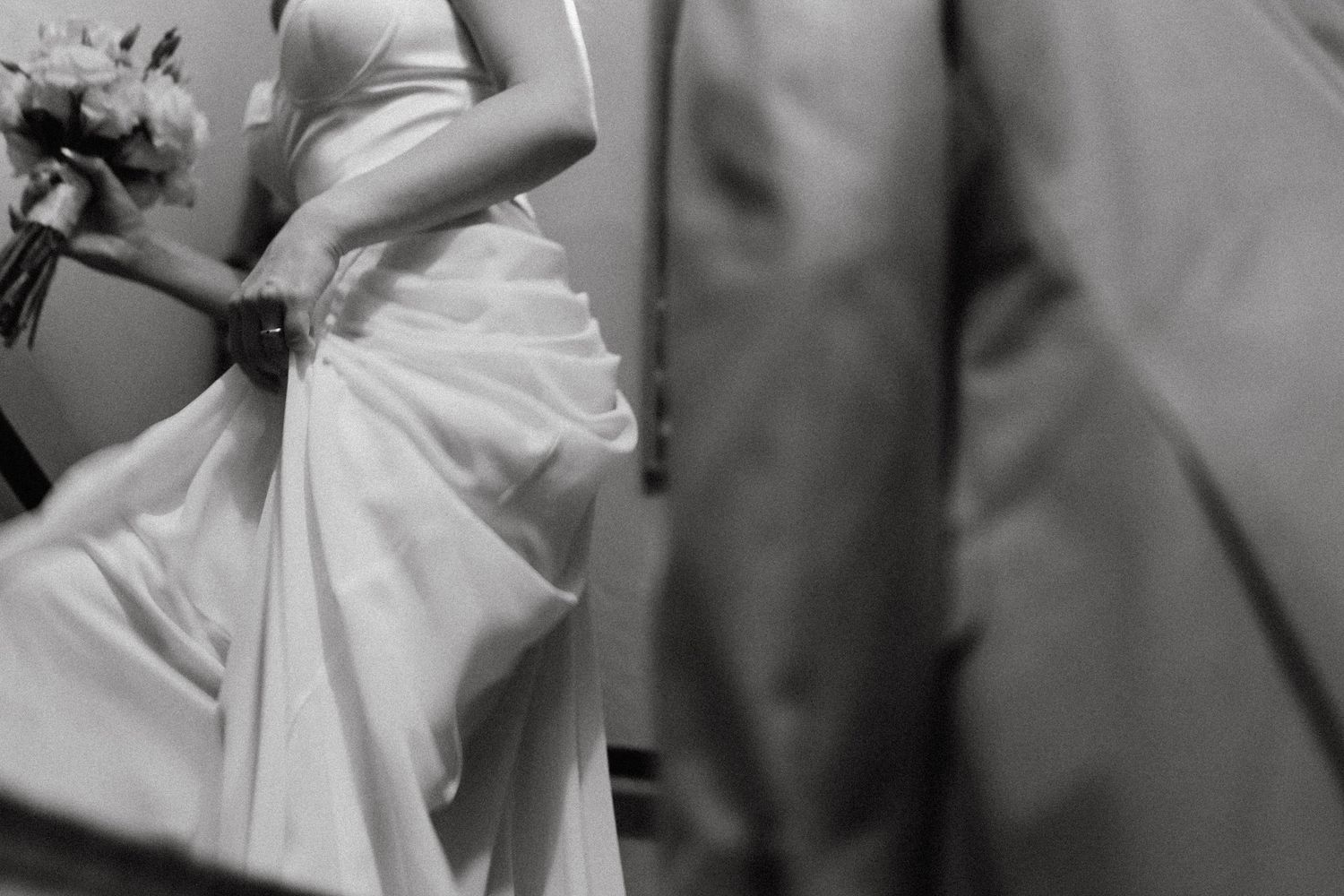 Black and white motion study of flowing wedding dress fabric.