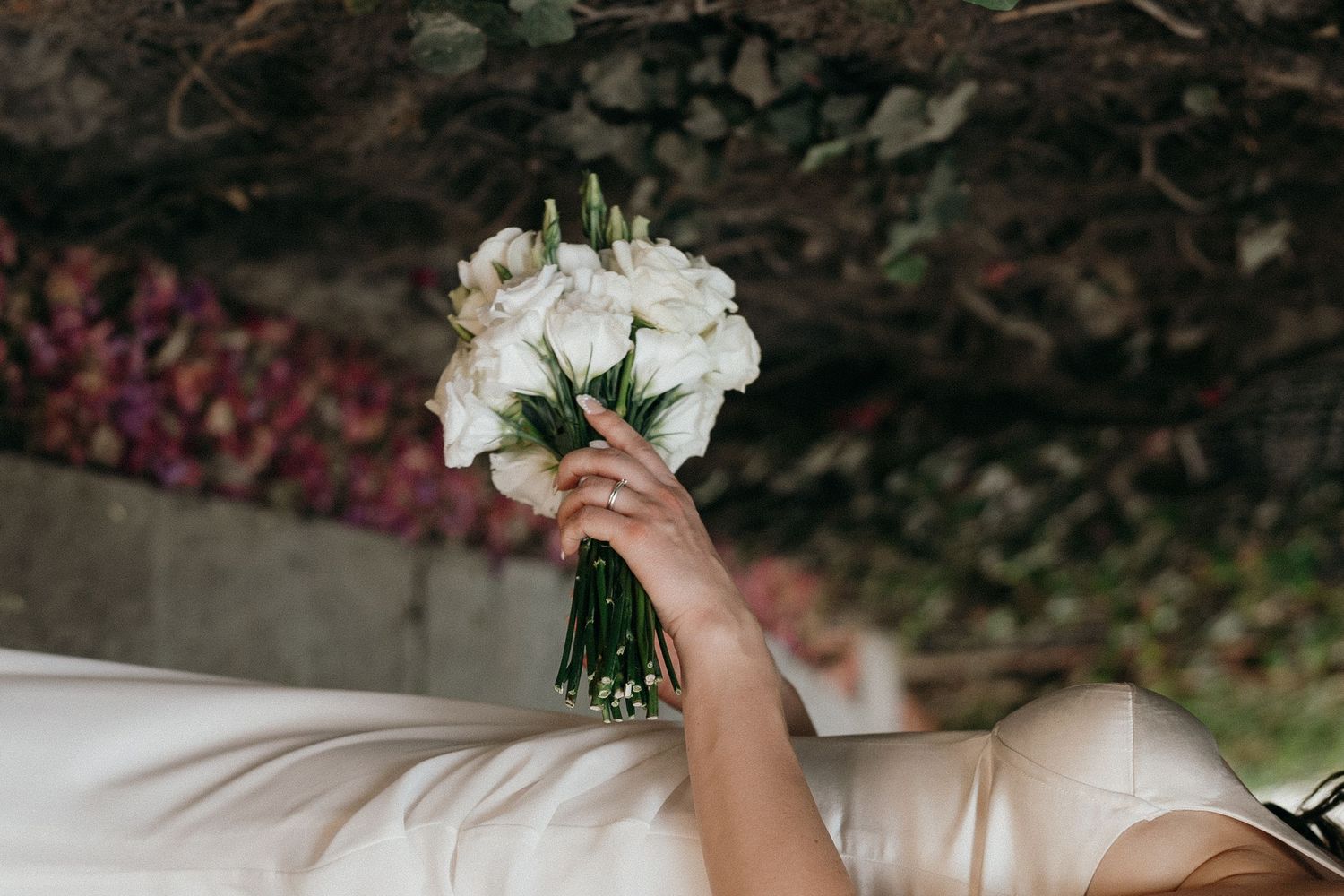 Close-up details of white wedding flowers and bouquet arrangements.