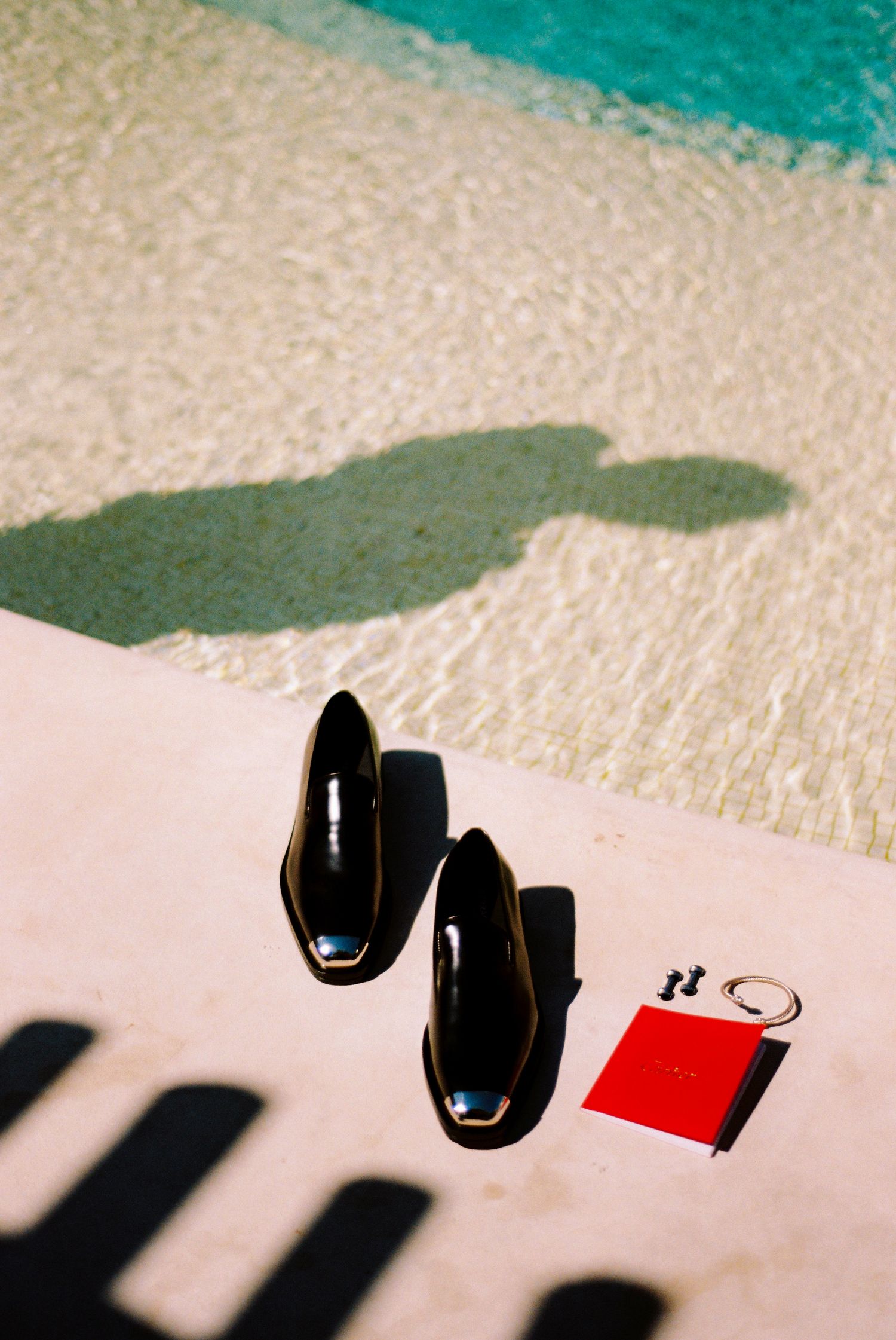 Timelapse sequence showing a computer mouse casting shadows on a white surface as it moves across the frame.