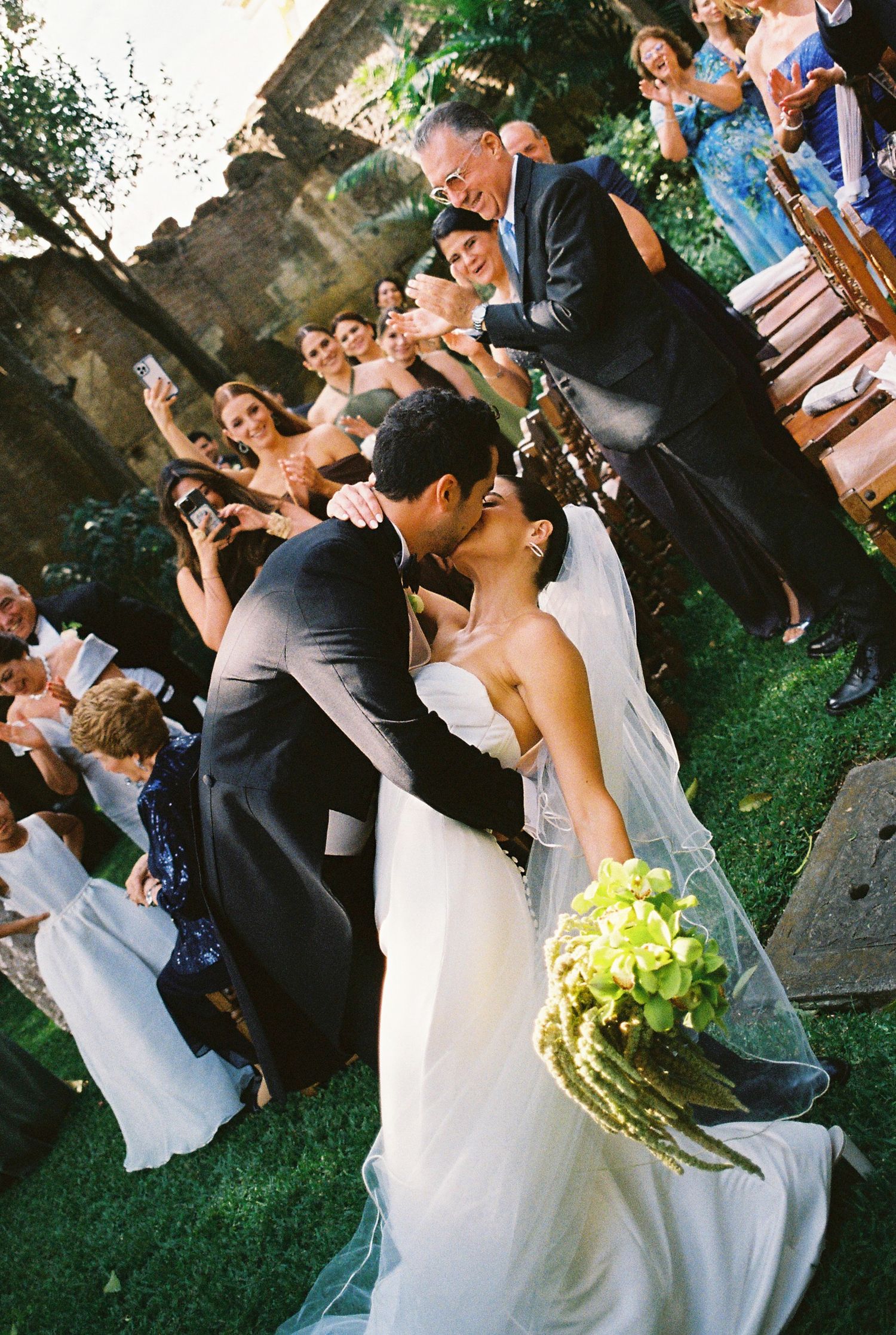 A romantic wedding ceremony moment captured in a lush garden setting.