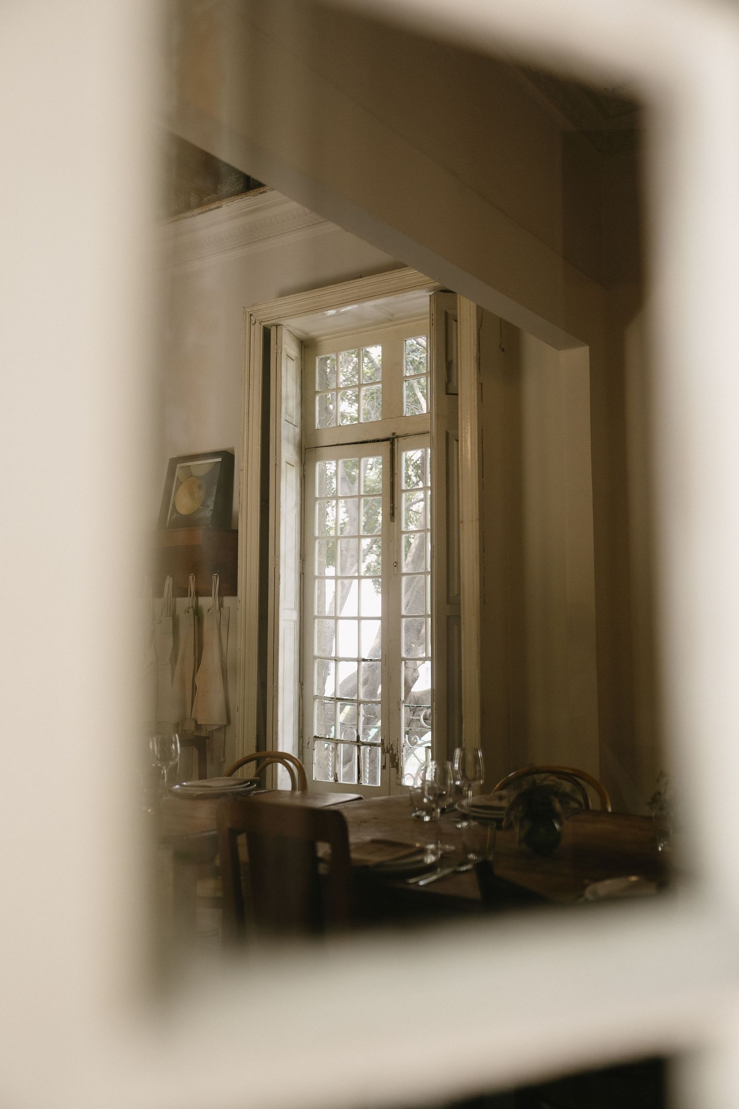 Soft-focus interior shots of vintage windows creating a dreamy atmosphere.