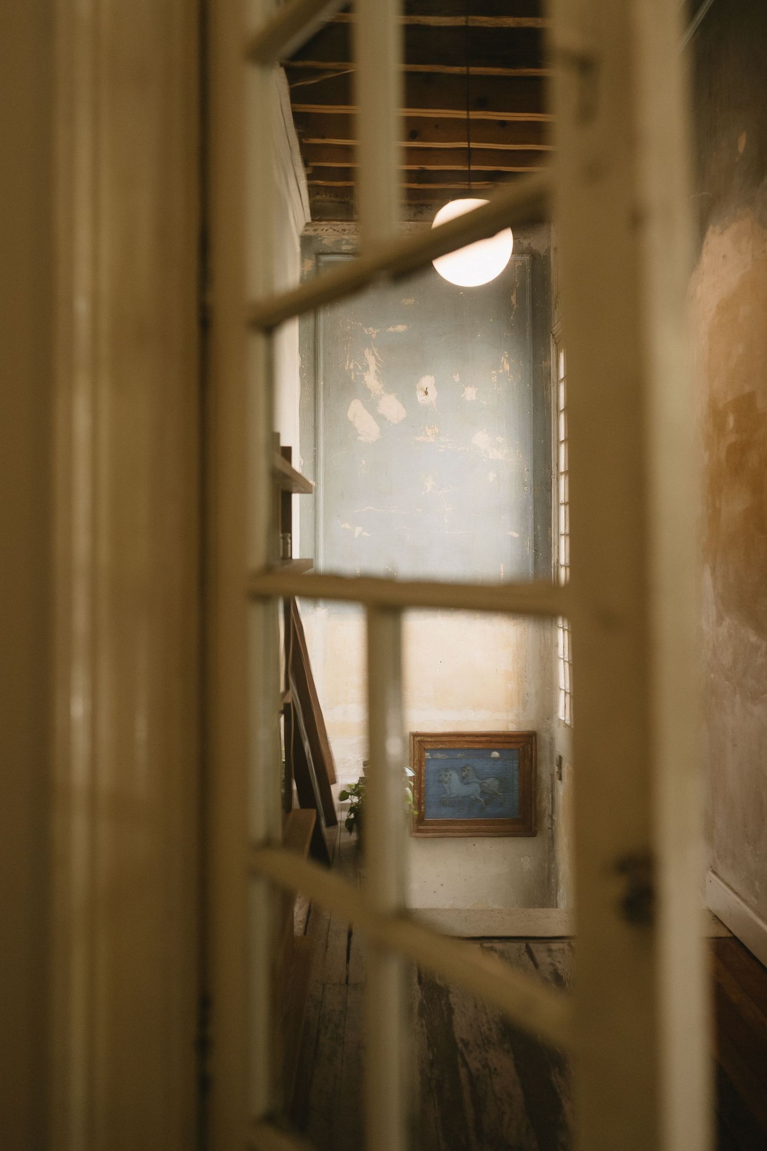 Soft focus interior shots through window panes creating a dreamy atmospheric effect.