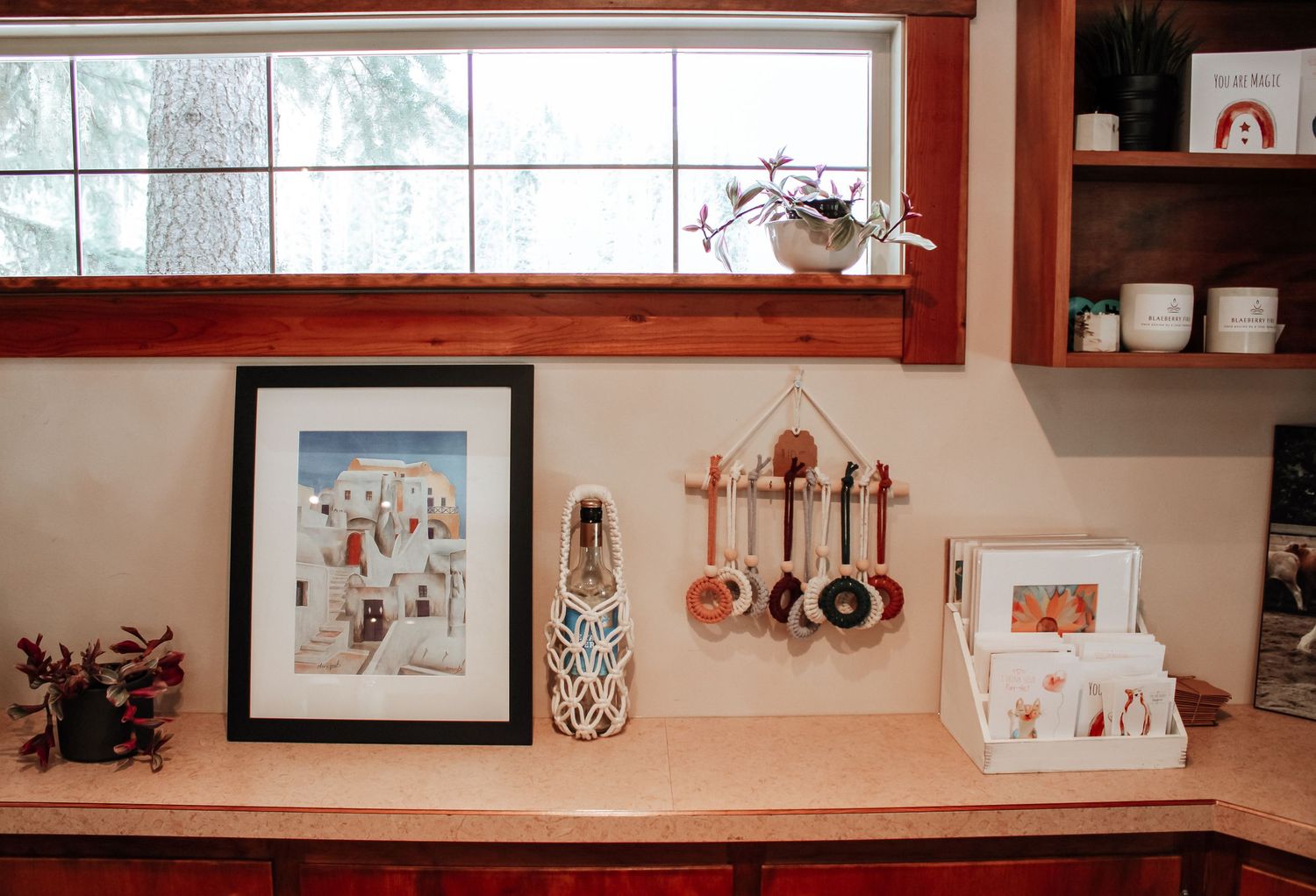 Rustic wooden window frame with decorative shelf displaying home decor items.