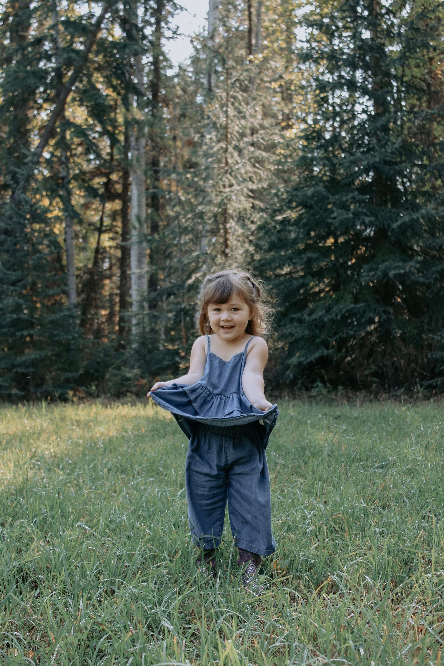 Playful sequence showing movement and joy in a forest clearing during golden hour.