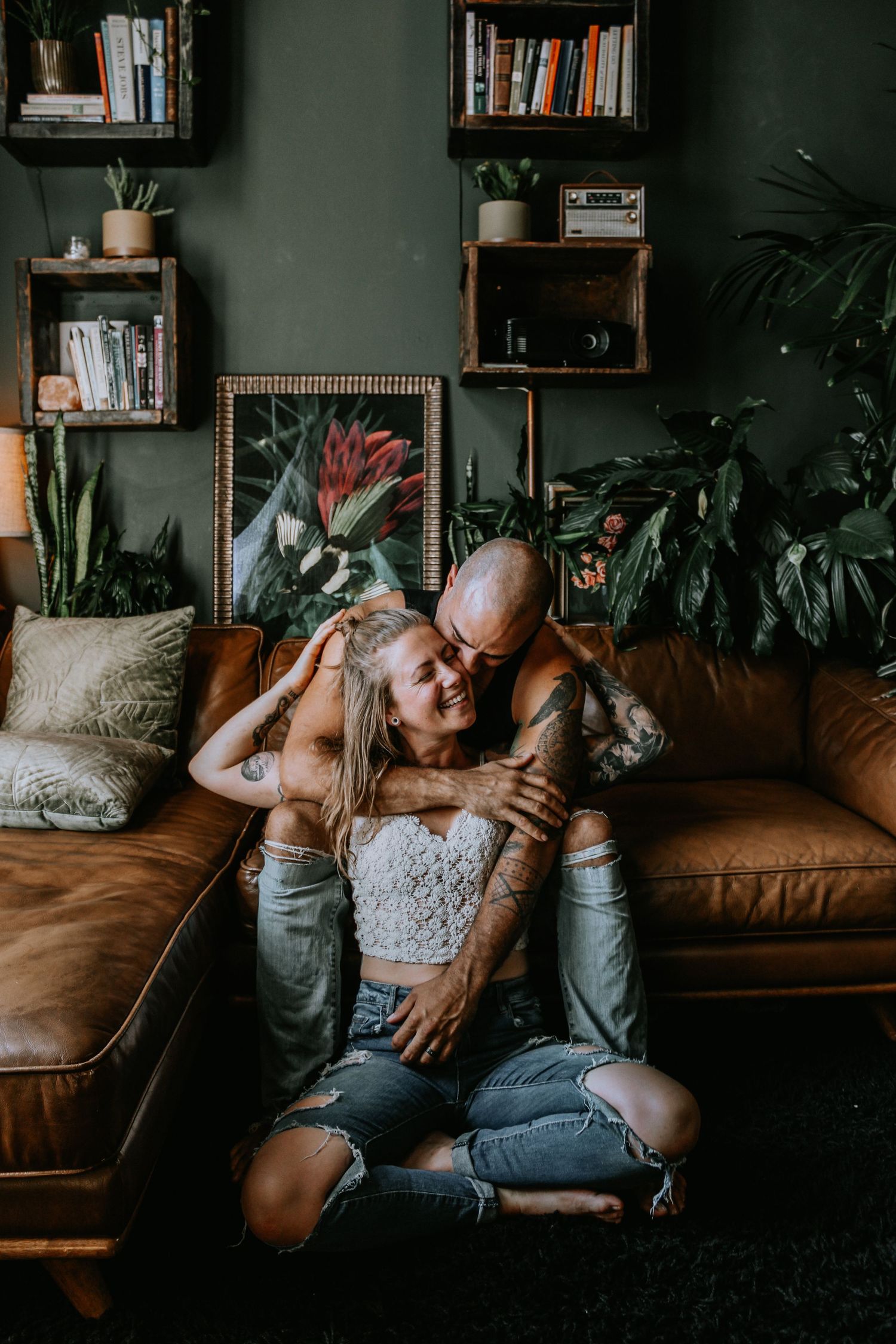 Candid moments captured in a dimly lit room with leather furniture and houseplants.