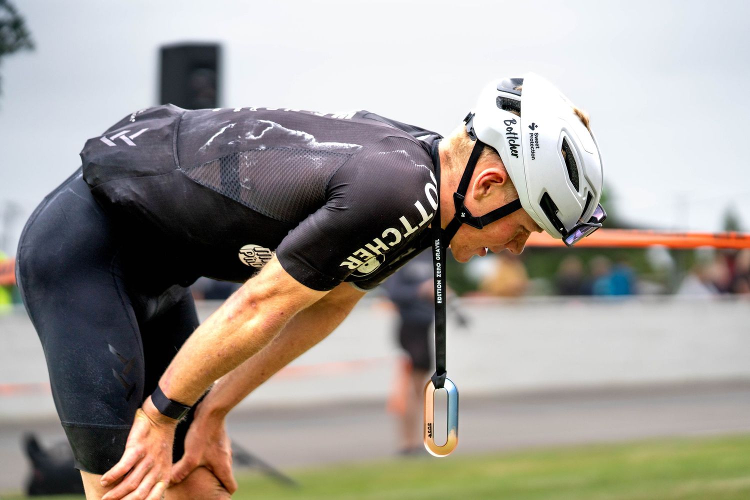 cyclist with his medal after coming second in the professional race. shows emotions