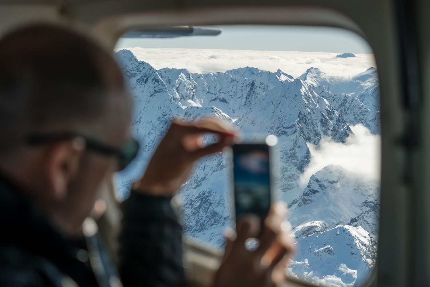 guests enjoying a scenic aeroplane flight over Fiordland national parl