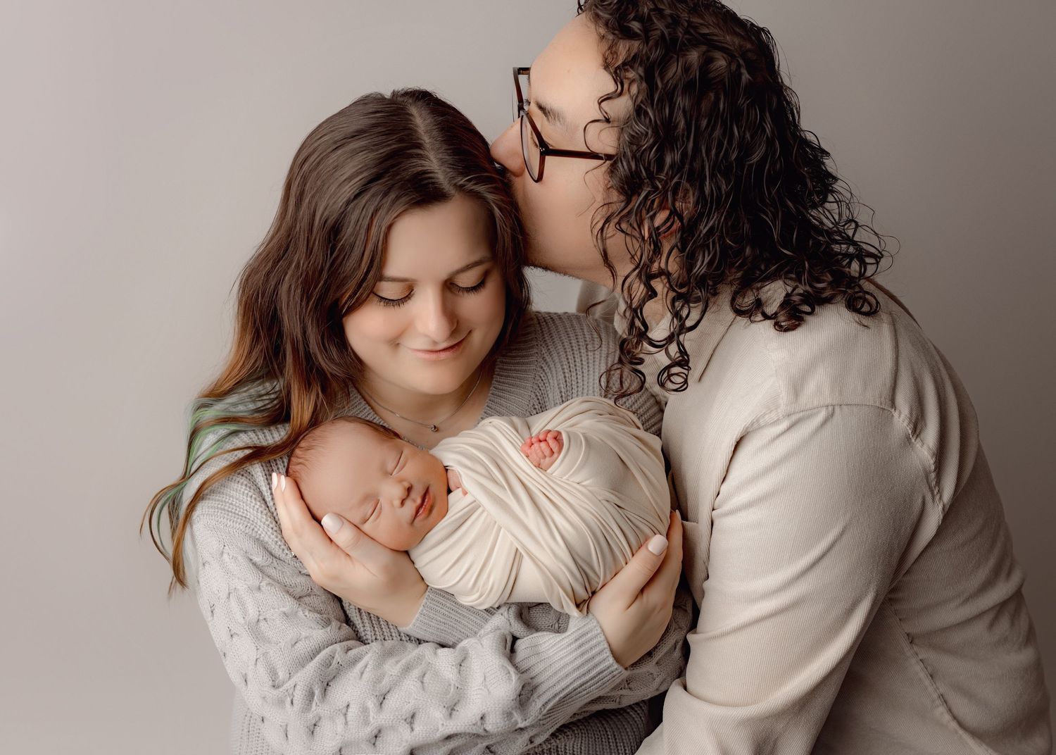 A tender moment captured in a series of intimate black and white photographs showing gentle embraces and connection.