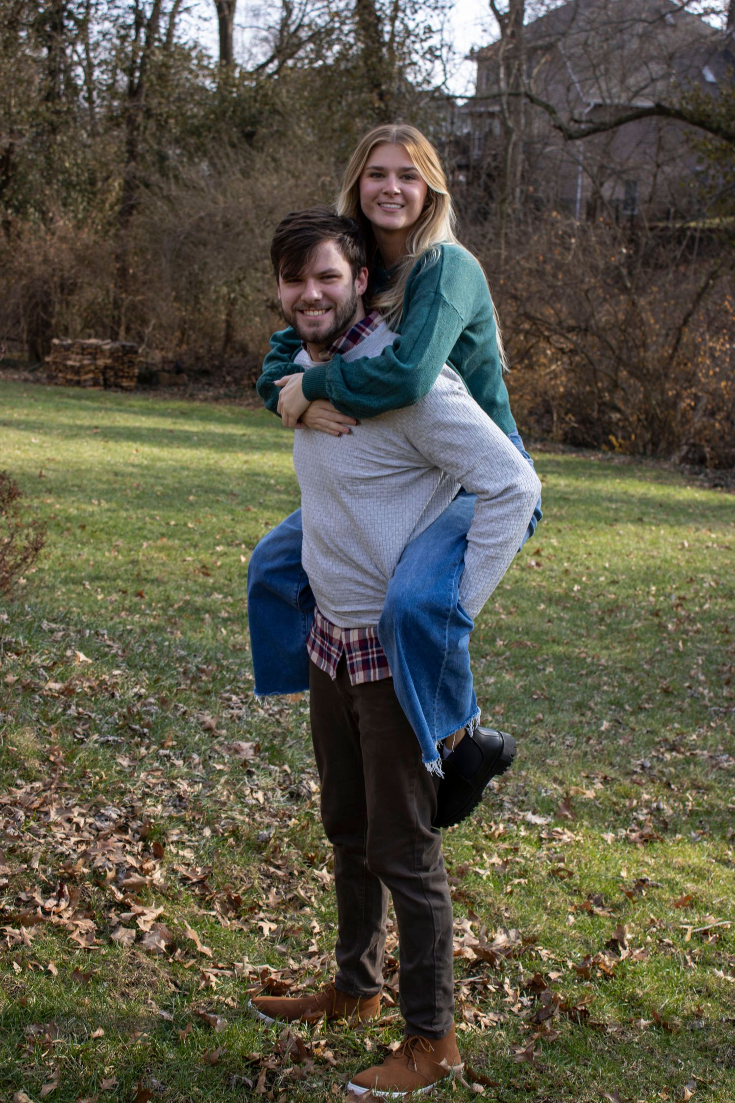 A series of playful outdoor couple portraits in a natural fall setting.