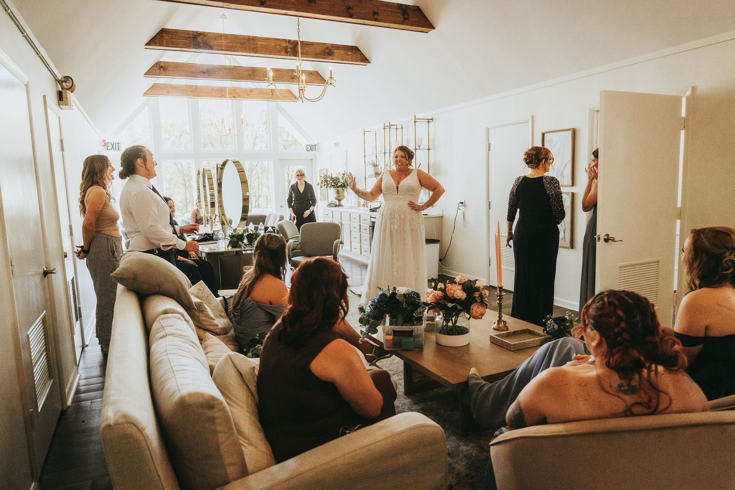 Panoramic view of bridal preparation room with exposed wooden beams.