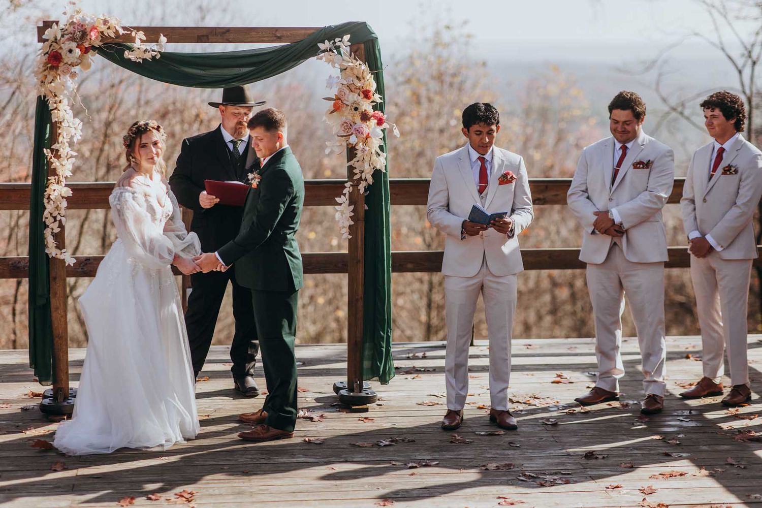 A wedding ceremony sequence captured at a scenic outdoor venue with rustic green posts and natural lighting.