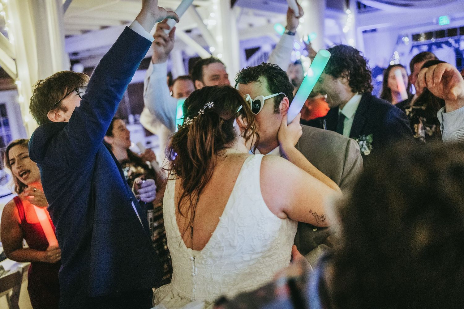 Wedding reception dance floor with blue and purple lighting effects.