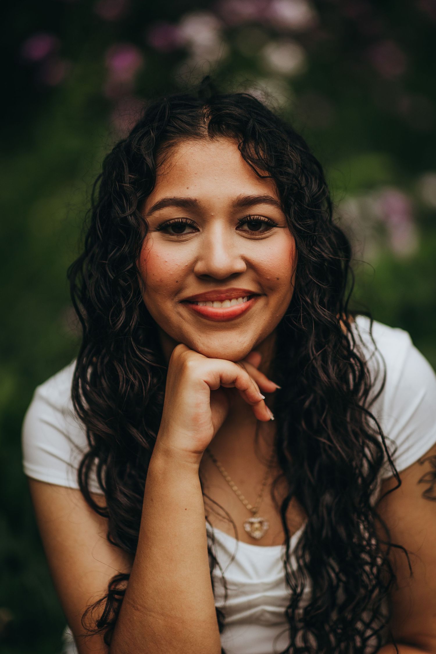 A series of close-up portraits showing curly dark hair and joyful expressions against a blurred green background.