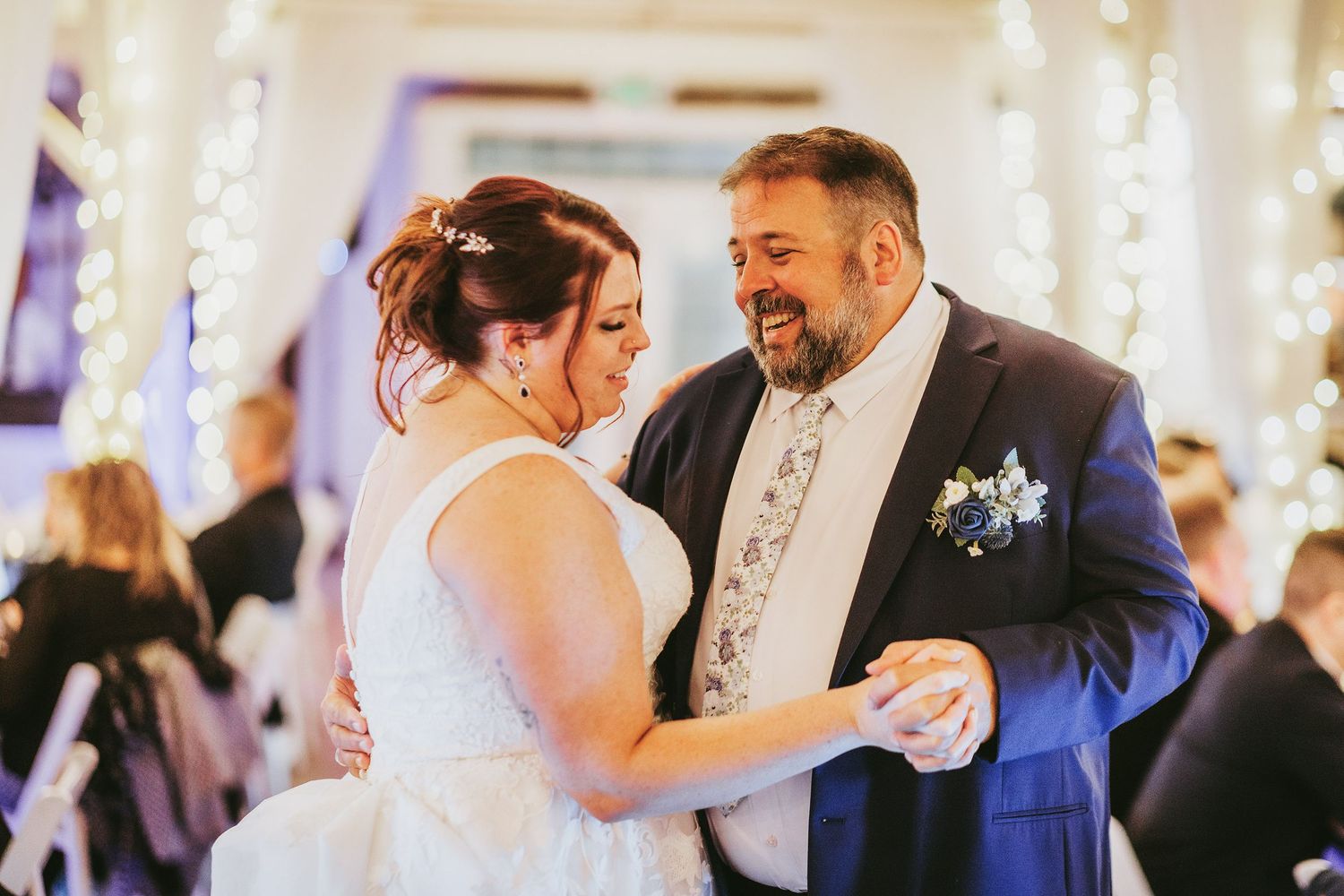 Couples dancing together during a wedding reception celebration.