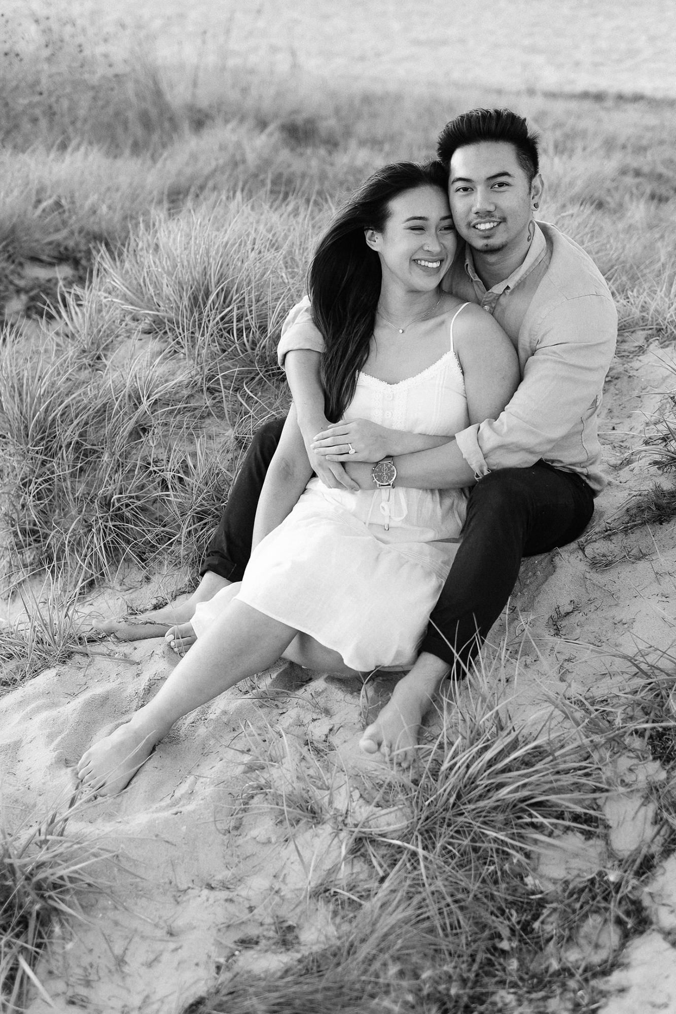 Coastal windswept couples portrait in Melbourne