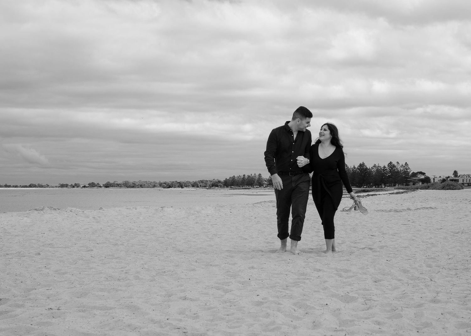 Candid couples walking on Altona beach in Melbourne
