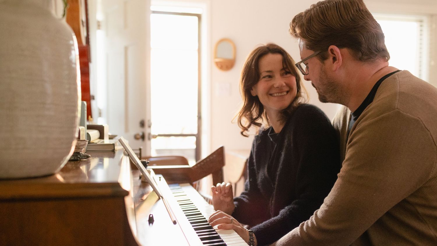 Couple photograph with actress and husband at home.